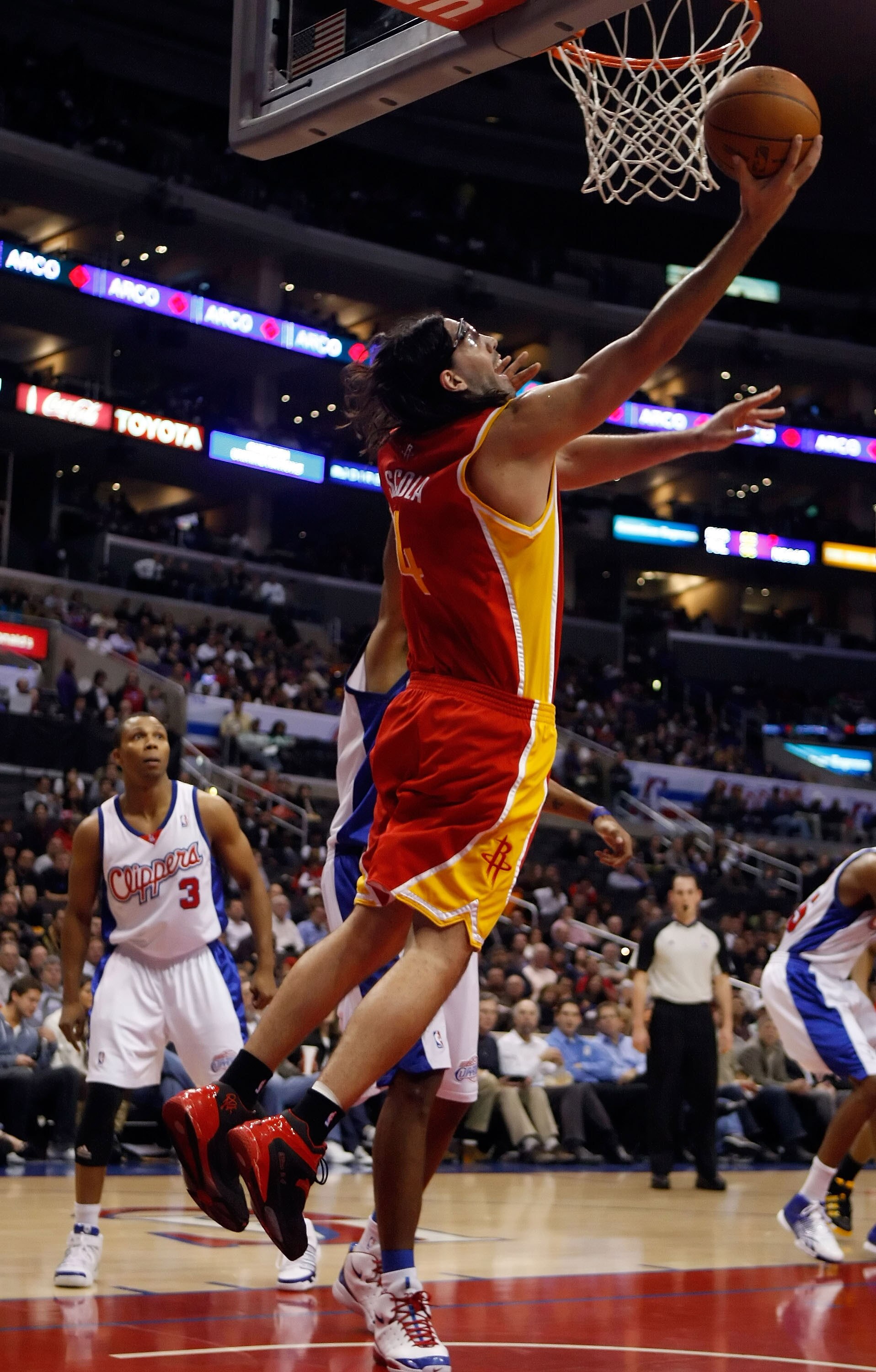 LOS ANGELES, CA - DECEMBER 02:  Luis Scola #4 of the Houston Rockets goes up for a reverse layup against the Los Angeles Clippers in the first half at Staples Center on December 2, 2009 in Los Angeles, California. The Rockets defeated the Clippers 102-85.