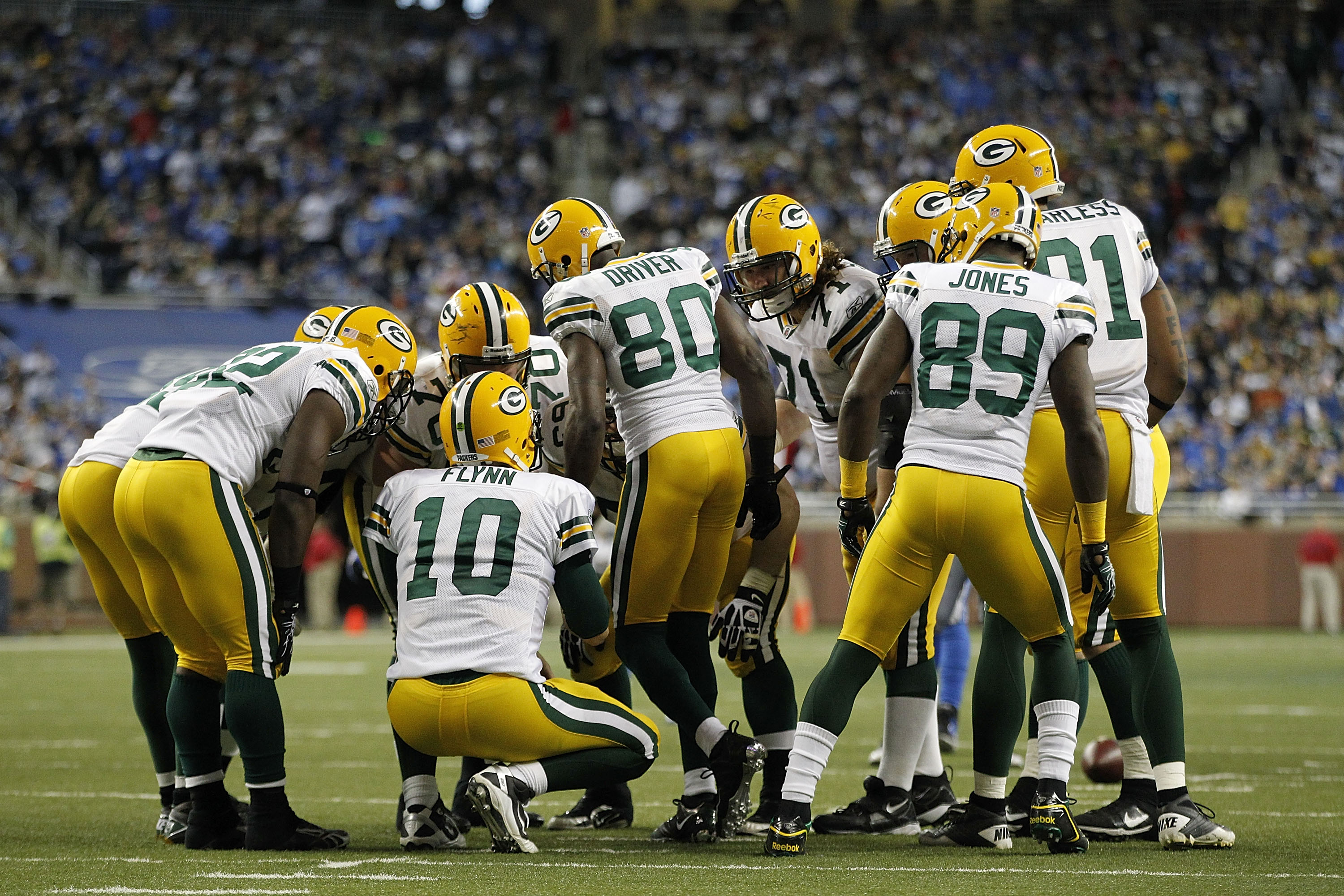 DETROIT - DECEMBER 12:  Matt Flynn #10 of the Green Bay Packers calls the play in the huddle during the third quarter of the game against the Detroit Lions at Ford Field on December 12, 2010 in Detroit, Michigan. The Lions defeated the Packers 7-3.  (Phot