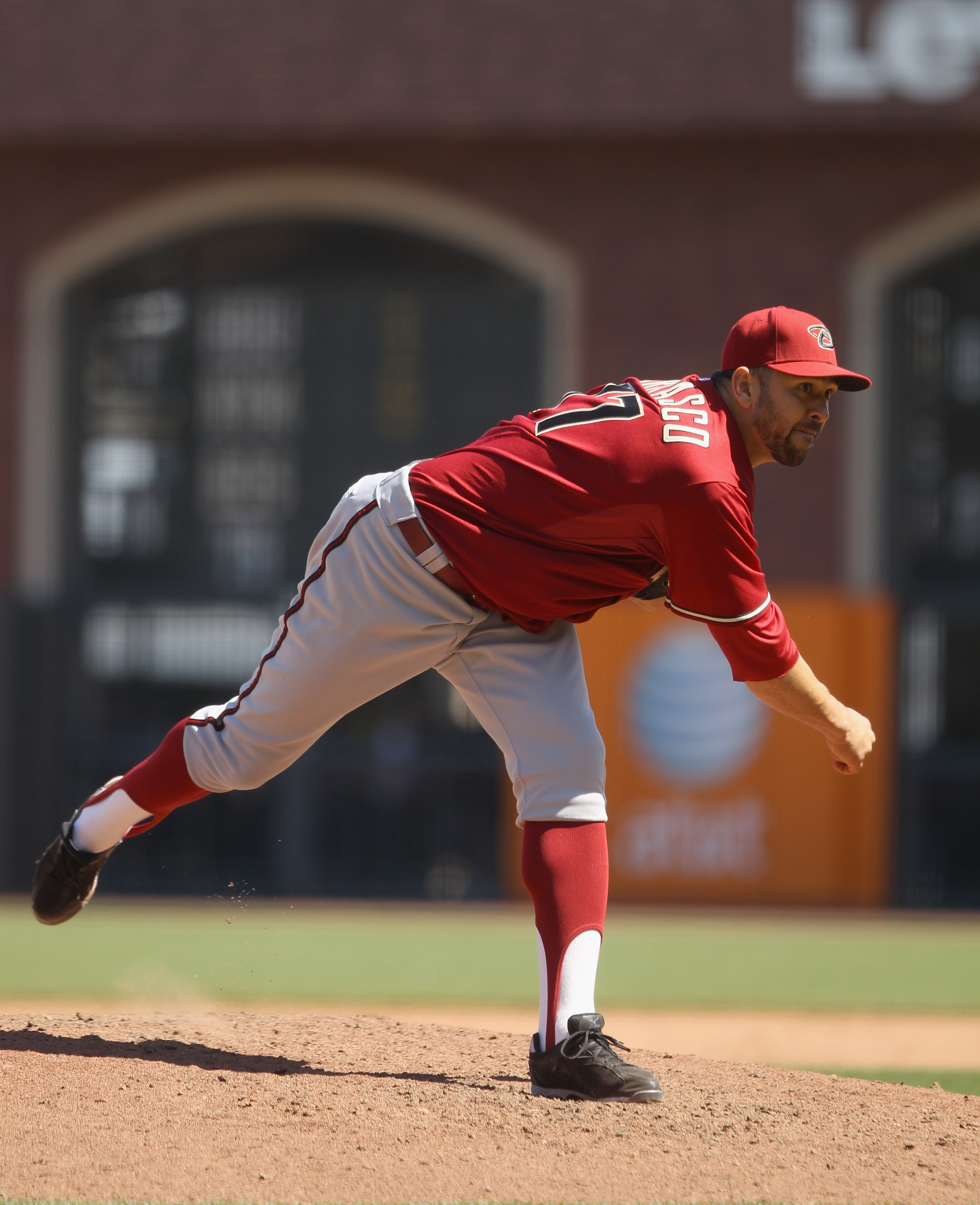 SAN FRANCISCO - AUGUST 29:  D.J. Carrasco #77 of the Arizona Diamondbacks pitches against the San Francisco Giants at AT&T Park on August 29, 2010 in San Francisco, California.  (Photo by Ezra Shaw/Getty Images)