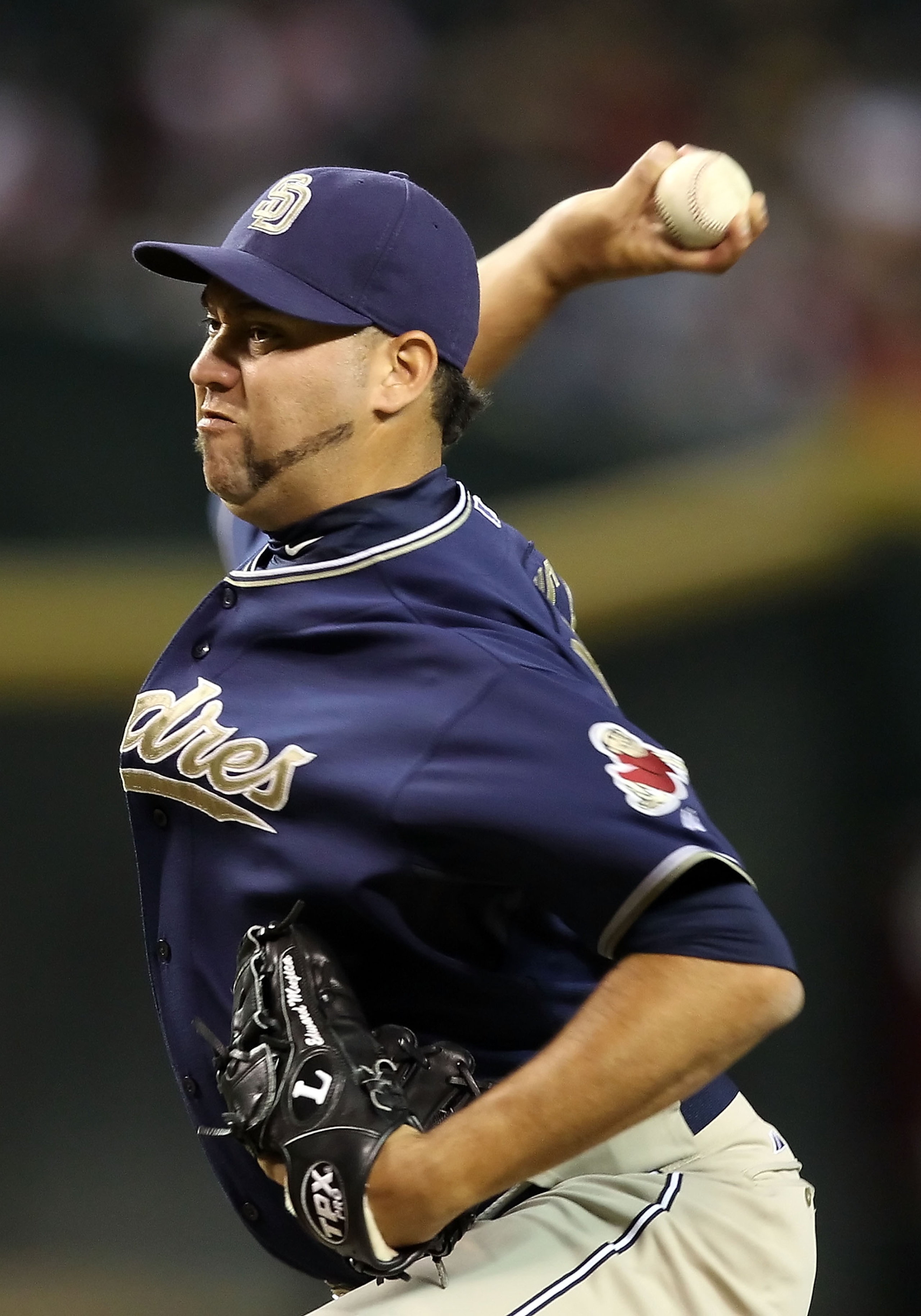 PHOENIX - AUGUST 30:  Relief pitcher Edward Mujica #45 of the San Diego Padres pitches against the Arizona Diamondbacks during the Major League Baseball game at Chase Field on August 30, 2010 in Phoenix, Arizona. The Diamondbacks defeated the Padres 7-2.