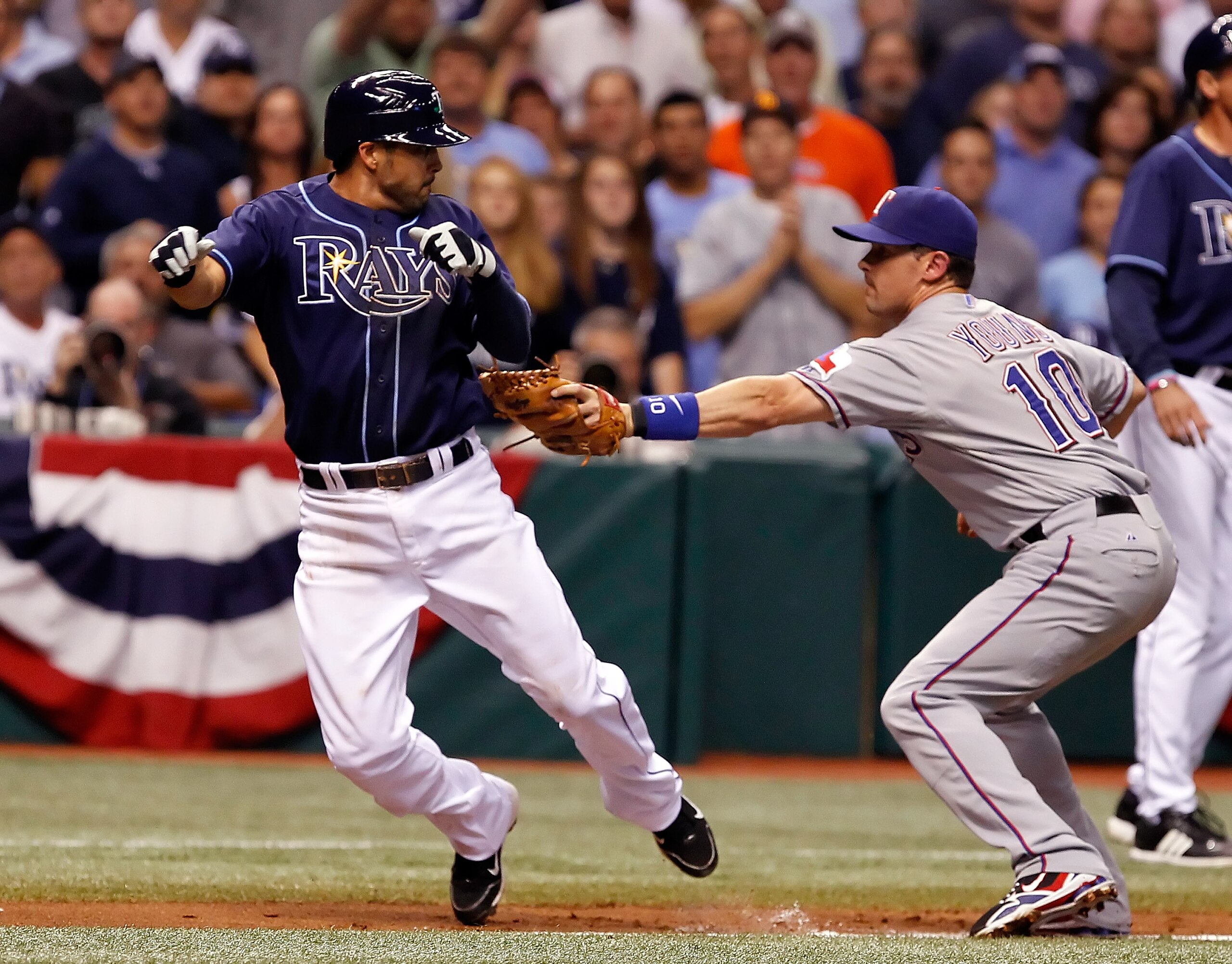 ST. PETERSBURG, FL - OCTOBER 12:  Infielder Jason Bartlett #8 of the Tampa Bay Rays is tagged out by Michael Young #10 of the Texas Rangers during Game 5 of the ALDS at Tropicana Field on October 12, 2010 in St. Petersburg, Florida.  (Photo by J. Meric/Ge