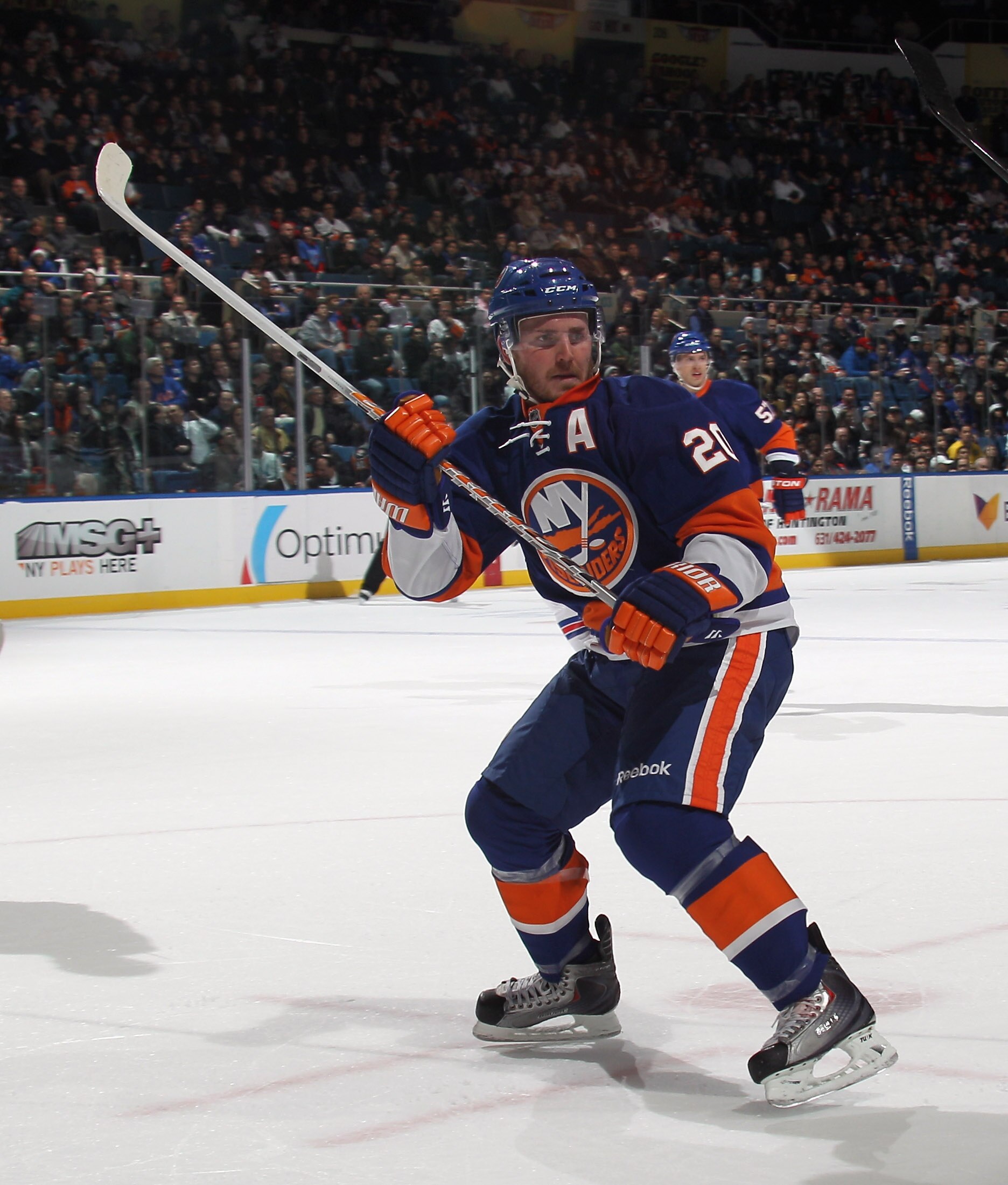 UNIONDALE, NY - DECEMBER 02:  James Wisniewski #20 of the New York Islanders skates against the New York Rangers at the Nassau Coliseum on December 2, 2010 in Uniondale, New York.  (Photo by Bruce Bennett/Getty Images)
