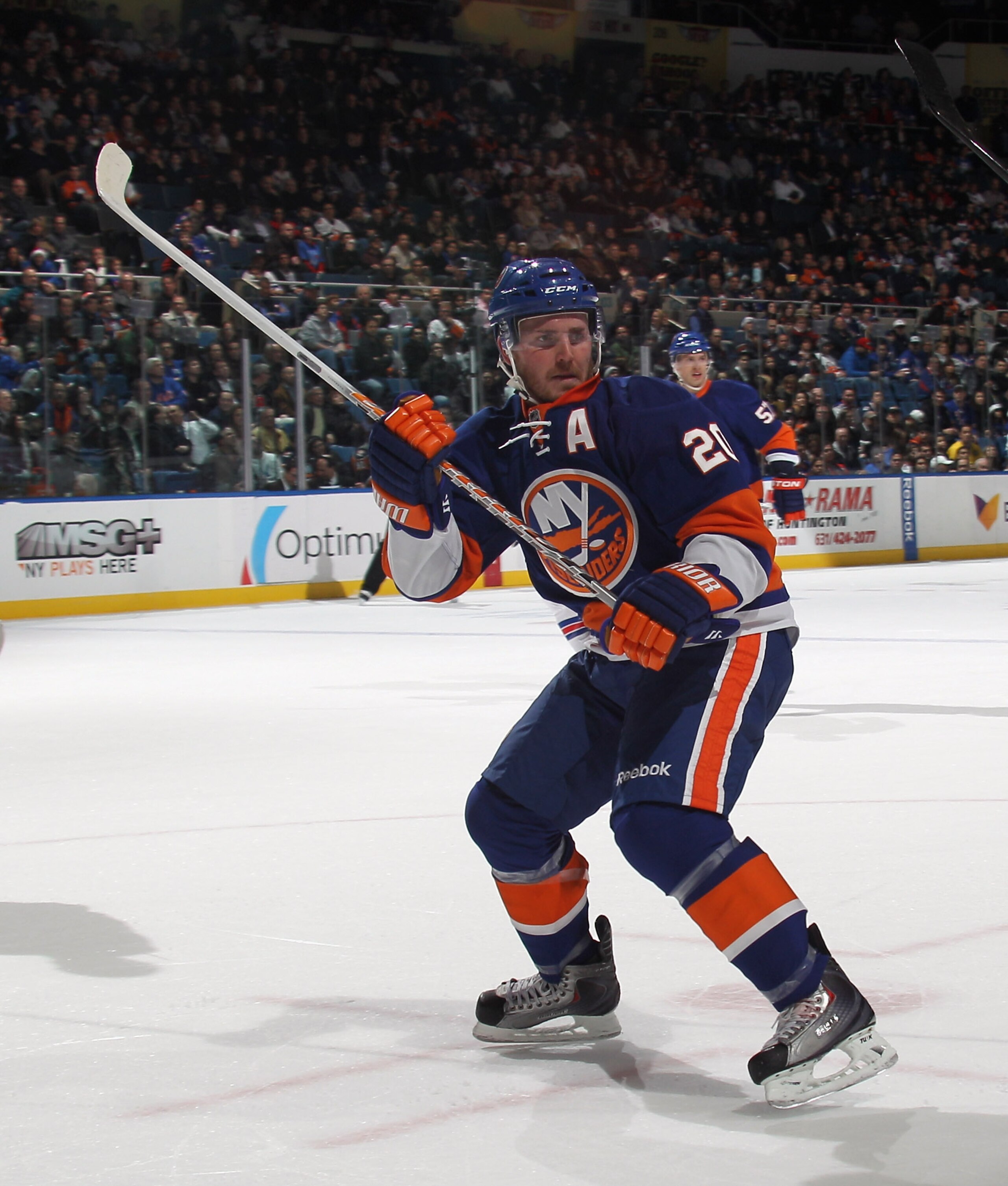 UNIONDALE, NY - DECEMBER 02:  James Wisniewski #20 of the New York Islanders skates against the New York Rangers at the Nassau Coliseum on December 2, 2010 in Uniondale, New York.  (Photo by Bruce Bennett/Getty Images)