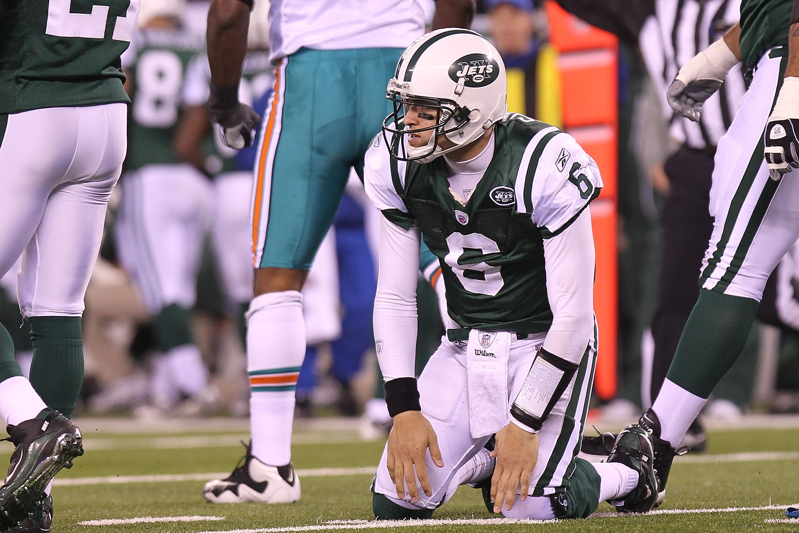 EAST RUTHERFORD, NJ - DECEMBER 12:  Mark Sanchez #6 of the New York Jets picks himself up after an incomplete pass against the Miami Dolphins at New Meadowlands Stadium on December 12, 2010 in East Rutherford, New Jersey.  (Photo by Nick Laham/Getty Image