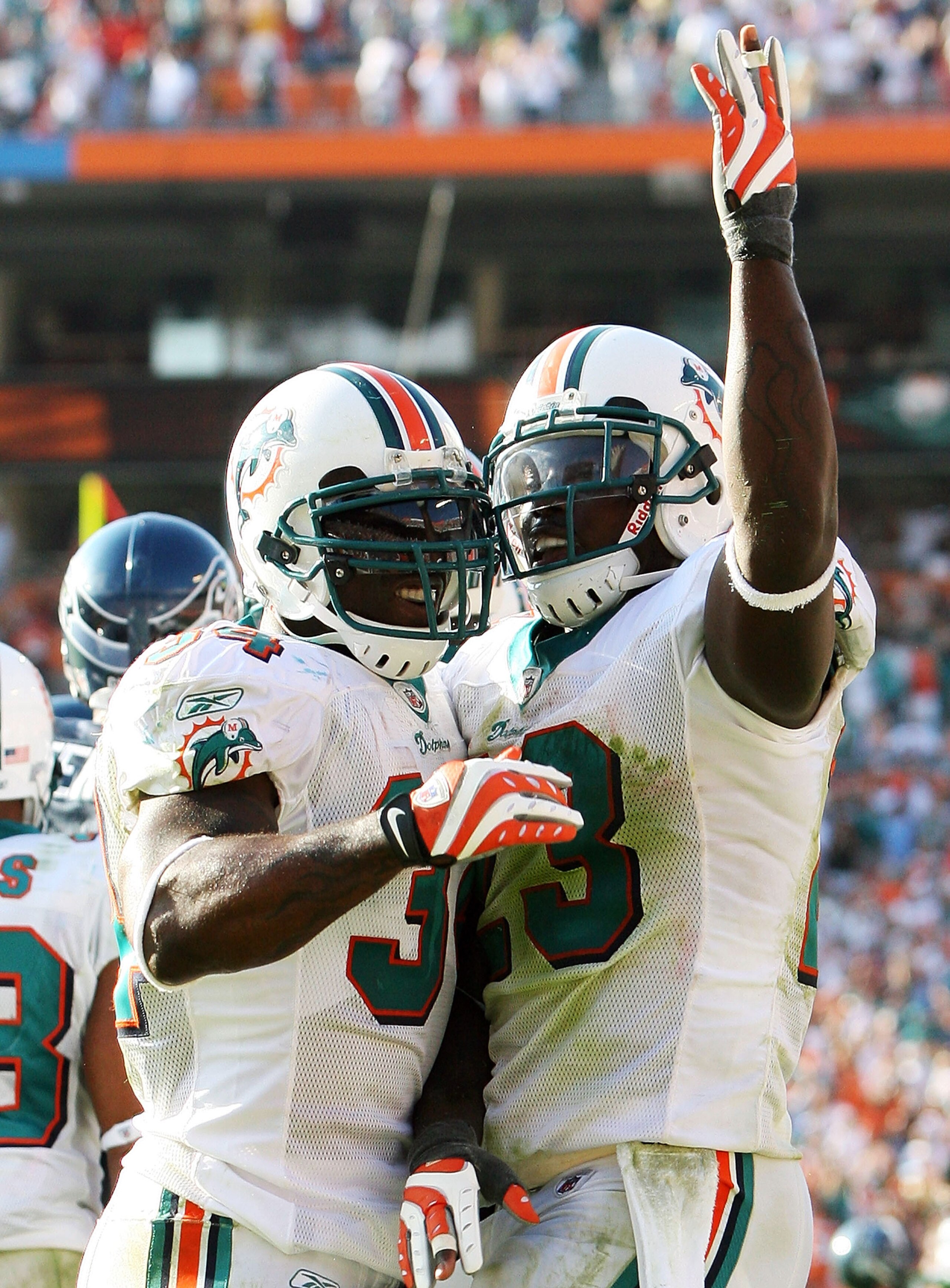 MIAMI - NOVEMBER 09:  Running back Ronnie Brown #23 and Ricky Williams #34 of the Miami Dolphins celebrate after Brown's touchdown run in the fourth quarter against the Seattle Seahawks at Dolphin Stadium on November 9, 2008 in Miami, Florida. The Dolphin