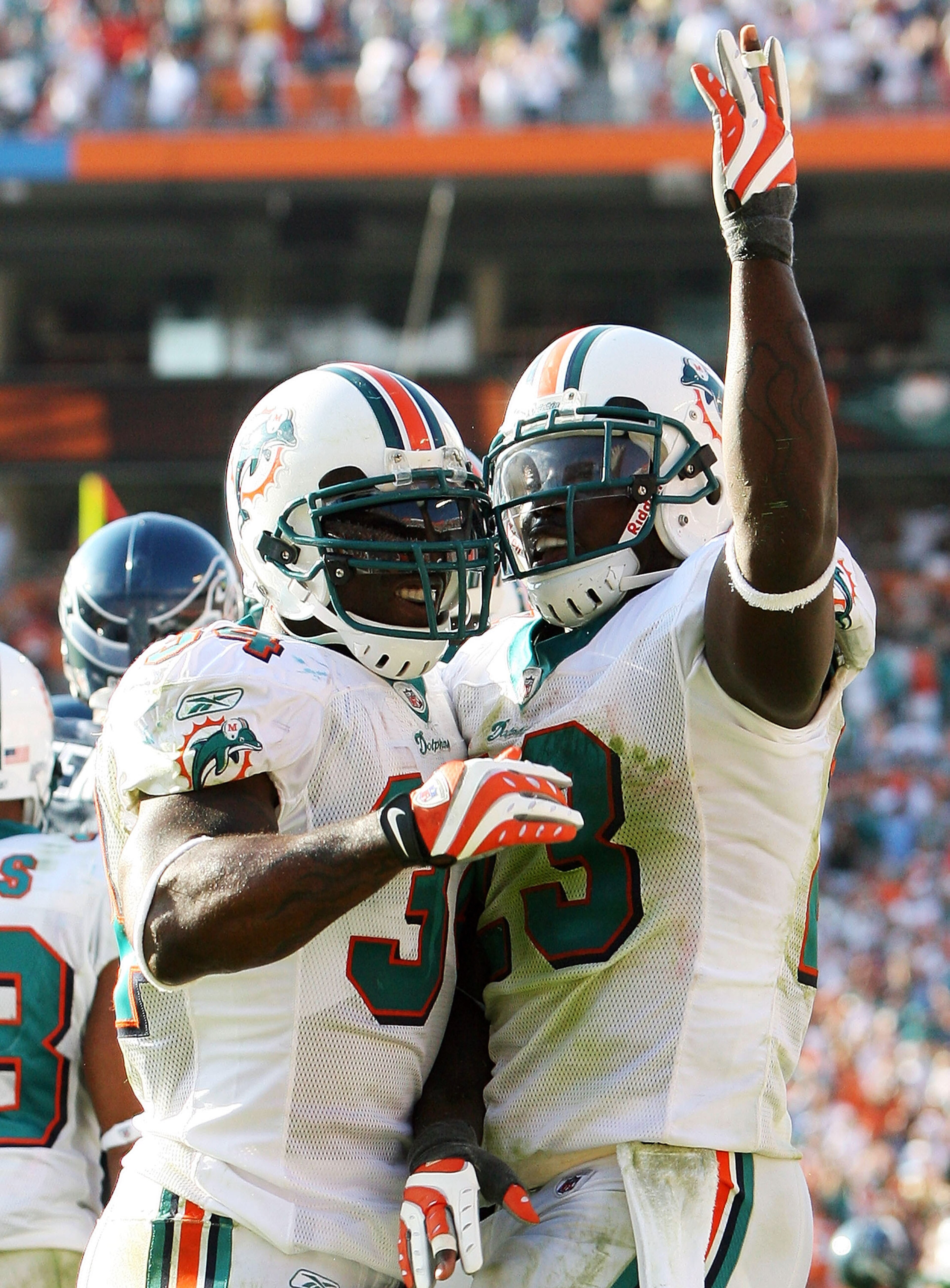 MIAMI - NOVEMBER 09:  Running back Ronnie Brown #23 and Ricky Williams #34 of the Miami Dolphins celebrate after Brown's touchdown run in the fourth quarter against the Seattle Seahawks at Dolphin Stadium on November 9, 2008 in Miami, Florida. The Dolphin