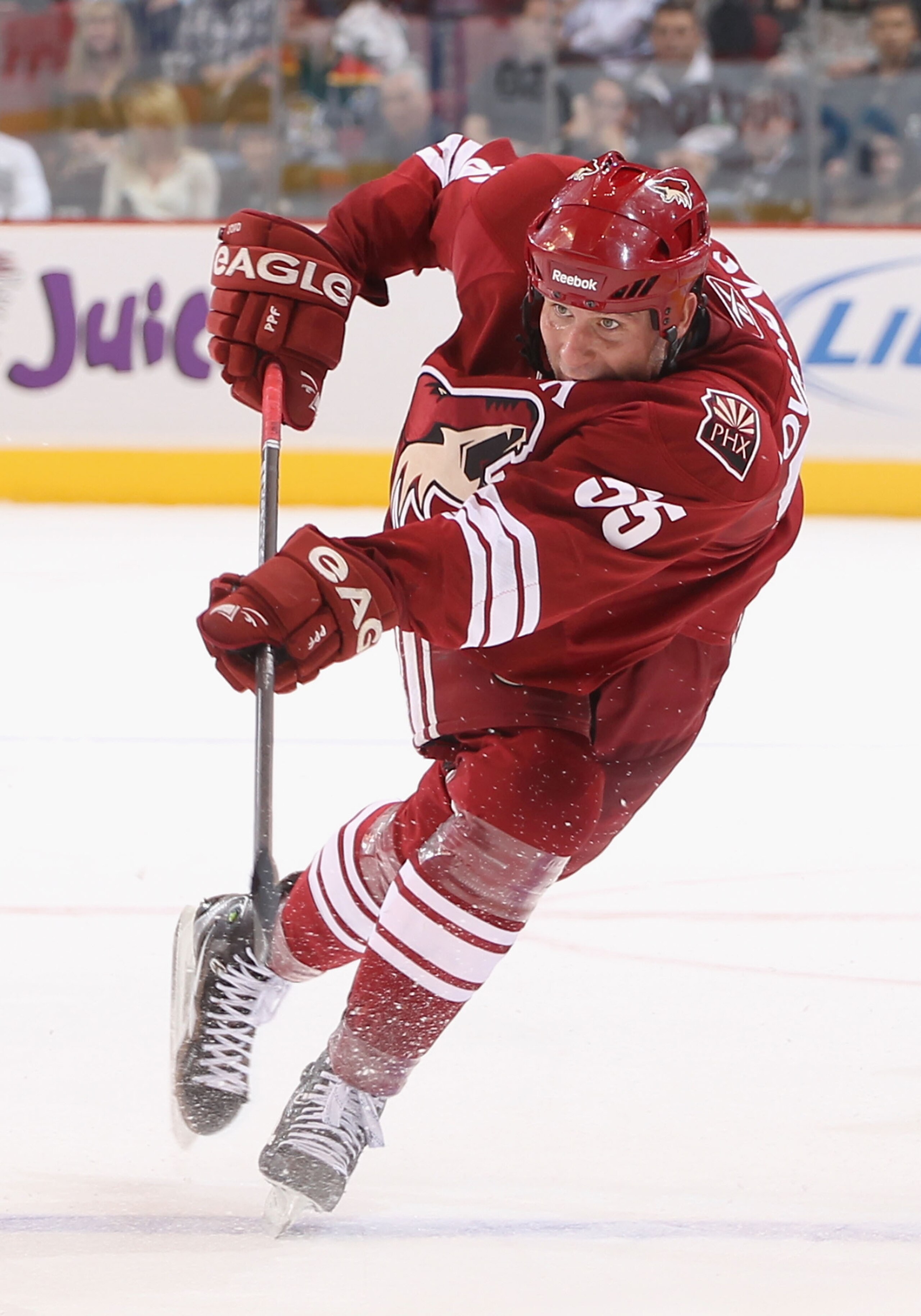 GLENDALE, AZ - DECEMBER 04:  Ed Jovanovski #55 of the Phoenix Coyotes shoots the puck during the NHL game against the Florida Panthers at Jobing.com Arena on December 4, 2010 in Glendale, Arizona. The Panthers defeated the Coyotes 2-1 in an overtime shoot