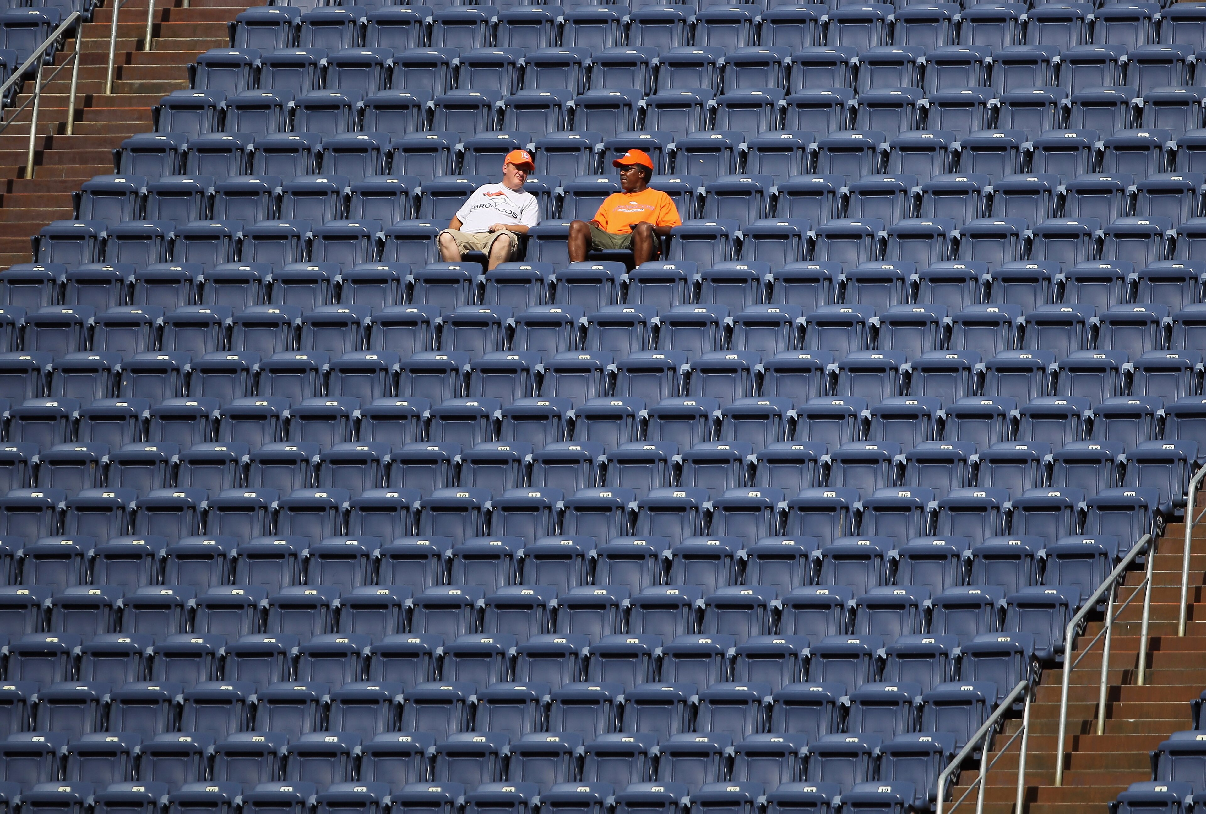 DENVER - AUGUST 21:  Fans settle into their seat early as the Denver Broncos host the Detroit Lions during preseason NFL action at INVESCO Field at Mile High on August 21, 2010 in Denver, Colorado.  (Photo by Doug Pensinger/Getty Images)