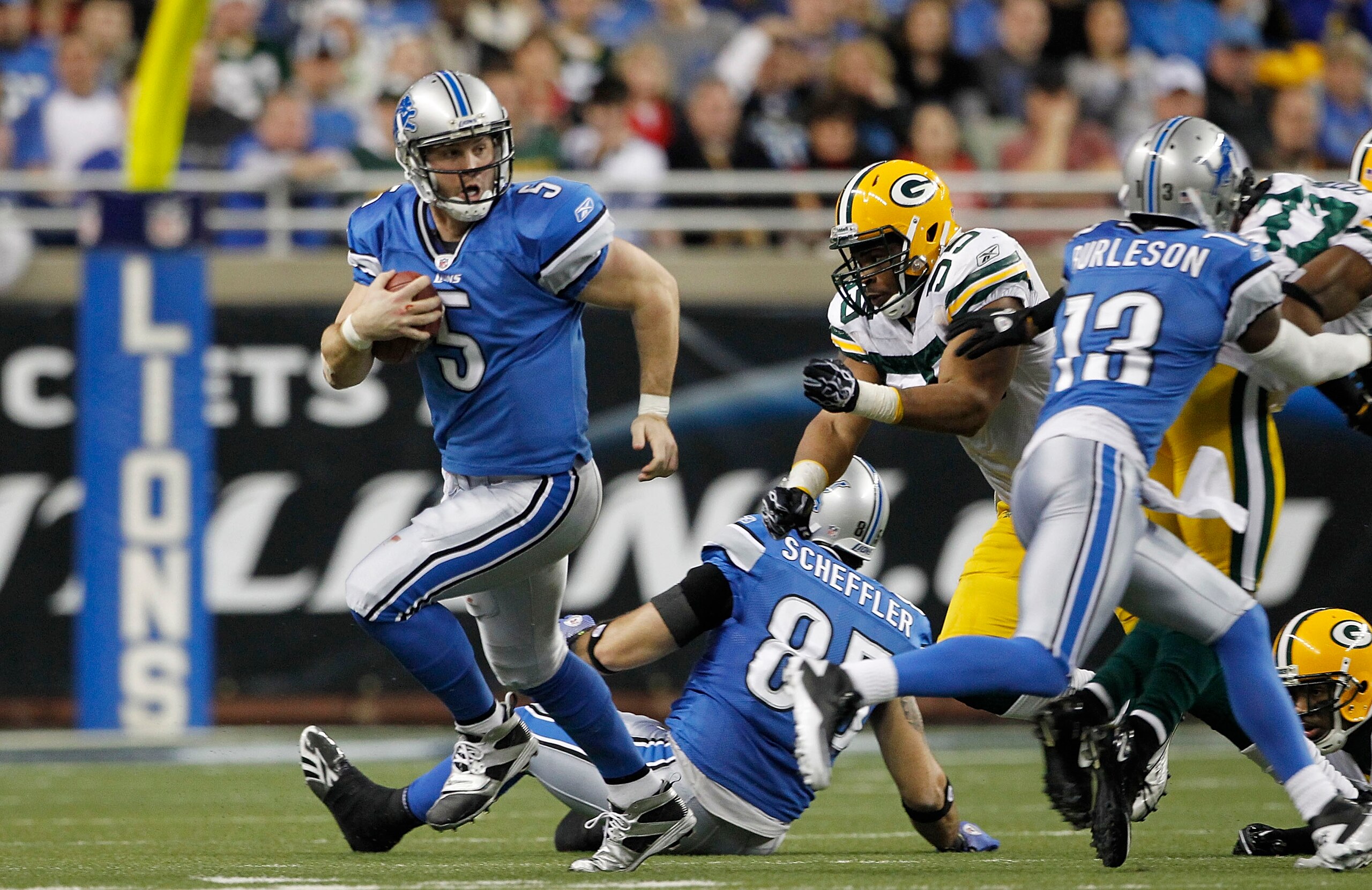 DETROIT - DECEMBER 12:  Drew Stanton #5 of the Detroit Lions runs for a first down during the the game against the Green Bay Packers at Ford Field on December 12, 2010 in Detroit, Michigan. The Lions defeated the Packers 7-3.  (Photo by Leon Halip/Getty I