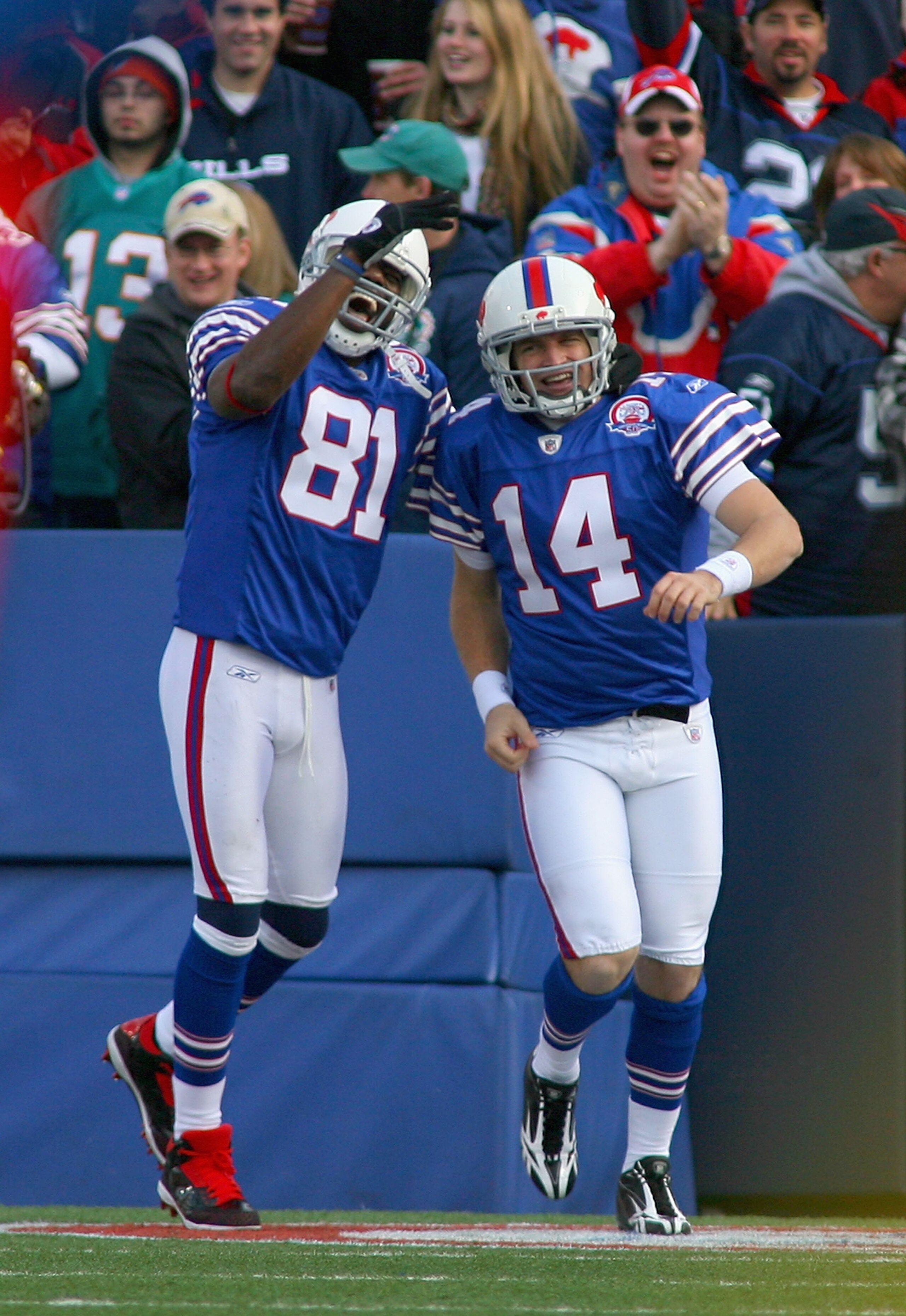 ORCHARD PARK, NY - NOVEMBER 29:  Terrell Owens #81 and Ryan Fitzpatrick #14 of the Buffalo Bills celebrate Fitzpatrick's 31 yard touchdown run against the Miami Dolphins at Ralph Wilson Stadium on November 29, 2009 in Orchard Park, New York.  (Photo by Ri