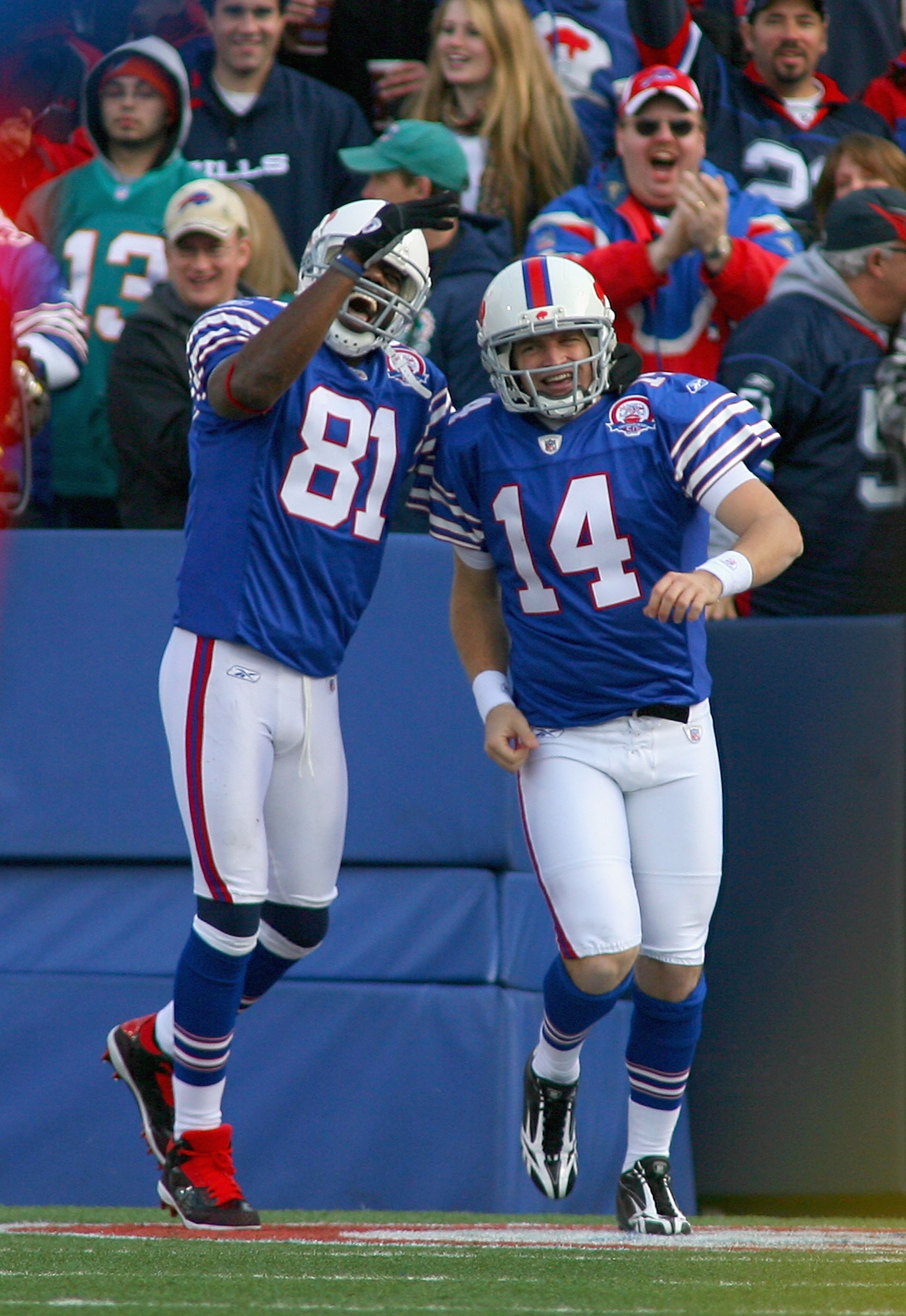 ORCHARD PARK, NY - NOVEMBER 29:  Terrell Owens #81 and Ryan Fitzpatrick #14 of the Buffalo Bills celebrate Fitzpatrick's 31 yard touchdown run against the Miami Dolphins at Ralph Wilson Stadium on November 29, 2009 in Orchard Park, New York.  (Photo by Ri