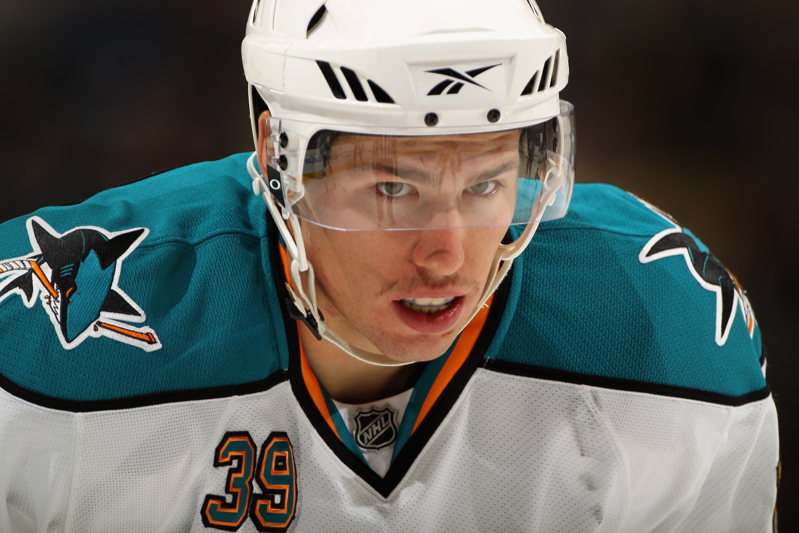 DENVER - NOVEMBER 17:  Logan Couture #39 of the San Jose Sharks prepares for a face off against the Colorado Avalanche at the Pepsi Center on November 17, 2010 in Denver, Colorado.  (Photo by Doug Pensinger/Getty Images)