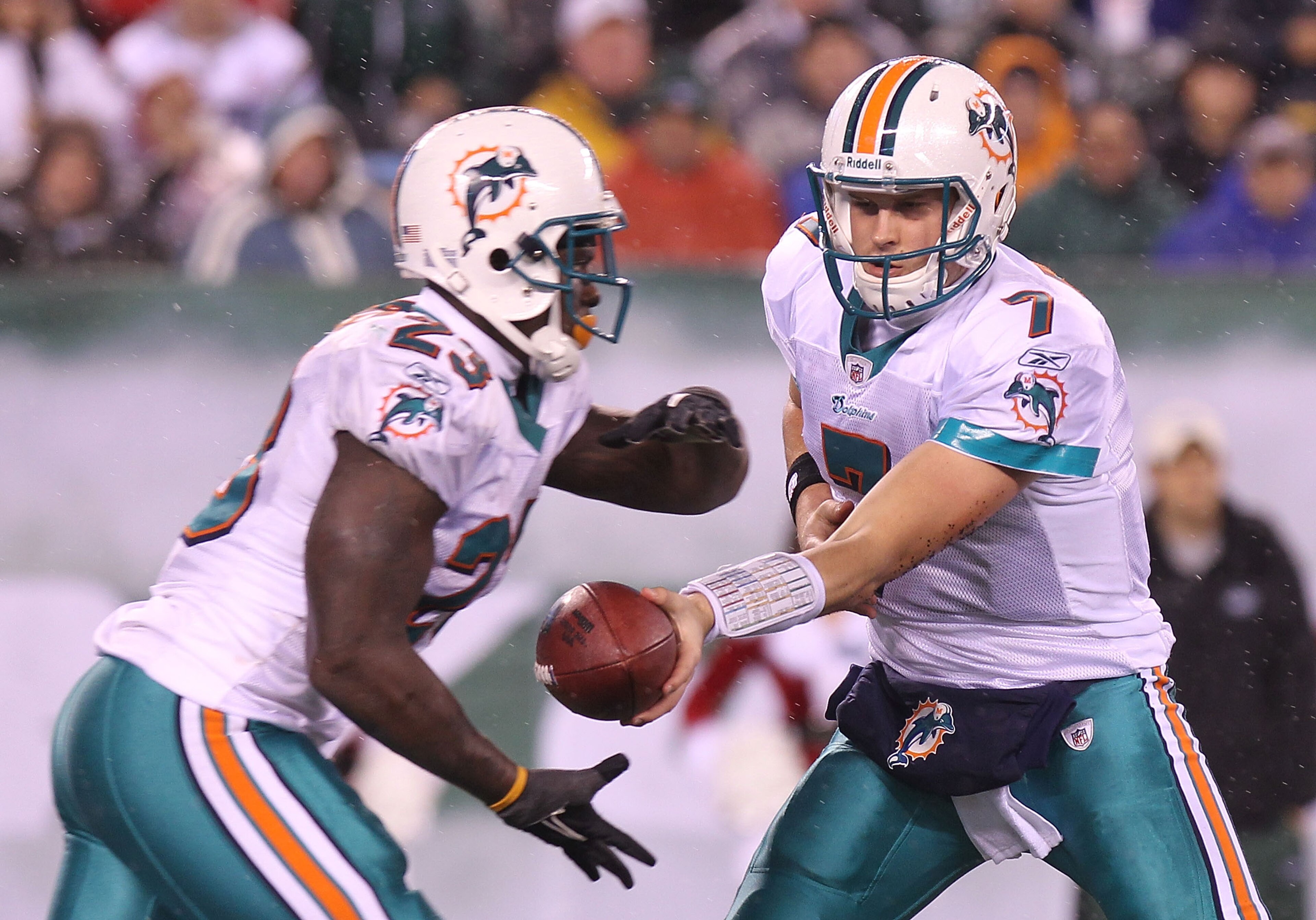 EAST RUTHERFORD, NJ - DECEMBER 12: Chad Henne #7 of the Miami Dolphins hands the ball off to  Ronnie Brown #23 against the New York Jets at New Meadowlands Stadium on December 12, 2010 in East Rutherford, New Jersey.  (Photo by Nick Laham/Getty Images)
