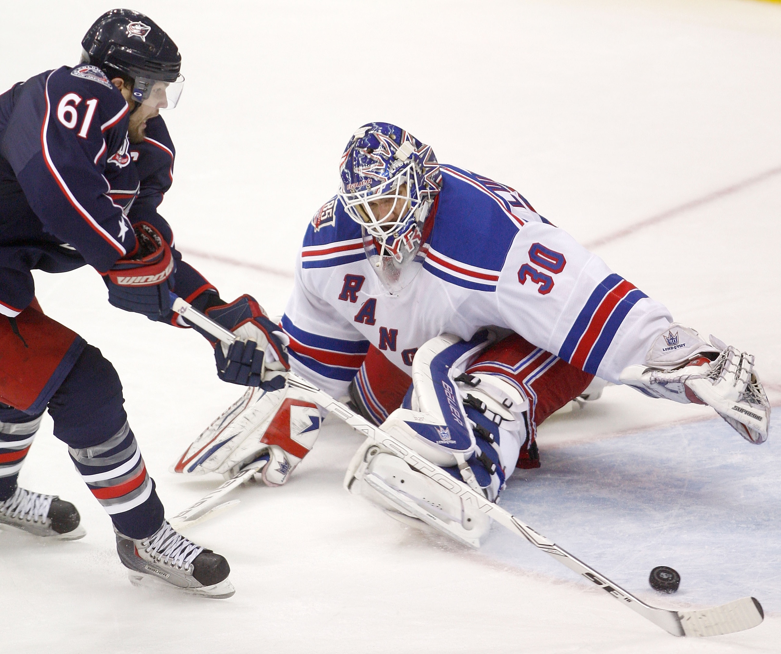 COLUMBUS,OH - DECEMBER 11:  Rick Nash #61 of the Columbus Blue Jackets beats goaltender Henrik Lundqvist #30 of the New York Rangers for his second goal of the game during the third period on December 11, 2010 at Nationwide Arena in Columbus, Ohio.  Colum