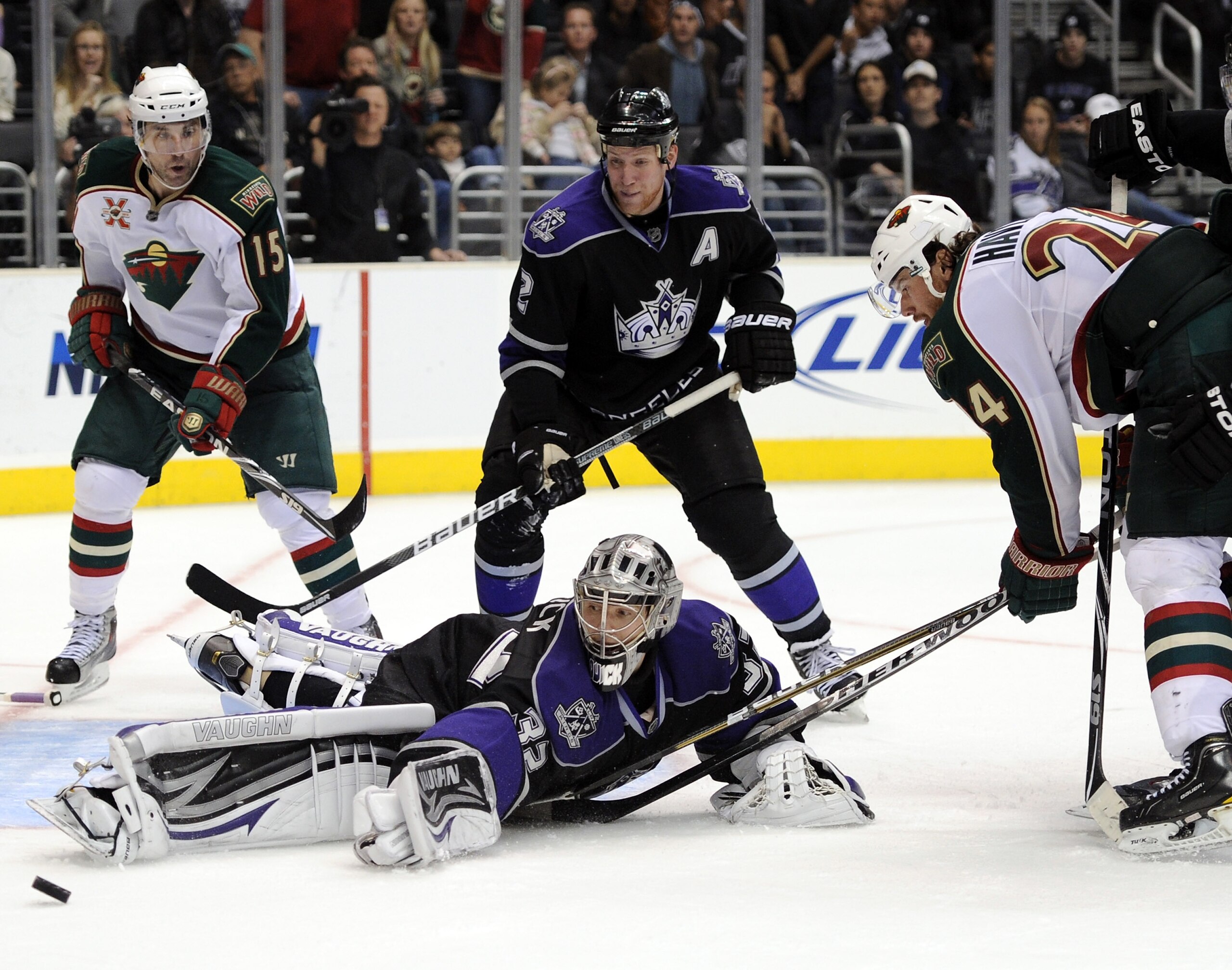 LOS ANGELES, CA - DECEMBER 11:  Jonathan Quick #32 of the Los Angeles Kings makes a save on Martin Havlat #24 of the Minnesota Wild as Matt Greene #2 and Andrew Brunette #15 look for a rebound during the third period at the Staples Center on December 11,