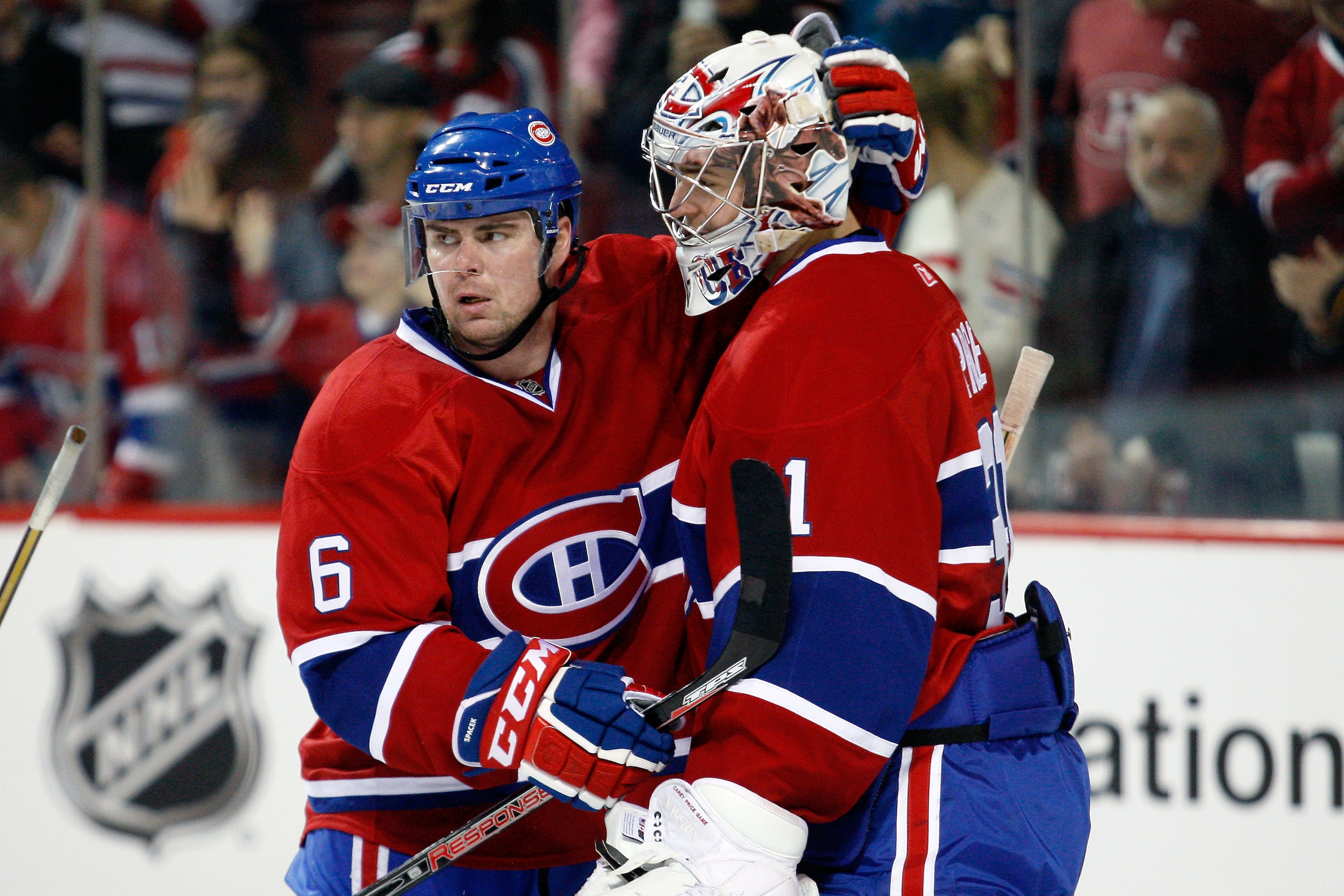MONTREAL- DECEMBER 4:  Jaroslav Spacek #6 celebrates with Carey Price #31 of the Montreal Canadiens after defeating the San Jose Sharks during the NHL game at the Bell Centre on December 4, 2010 in Montreal, Quebec, Canada.  The Canadiens defeated the Sha