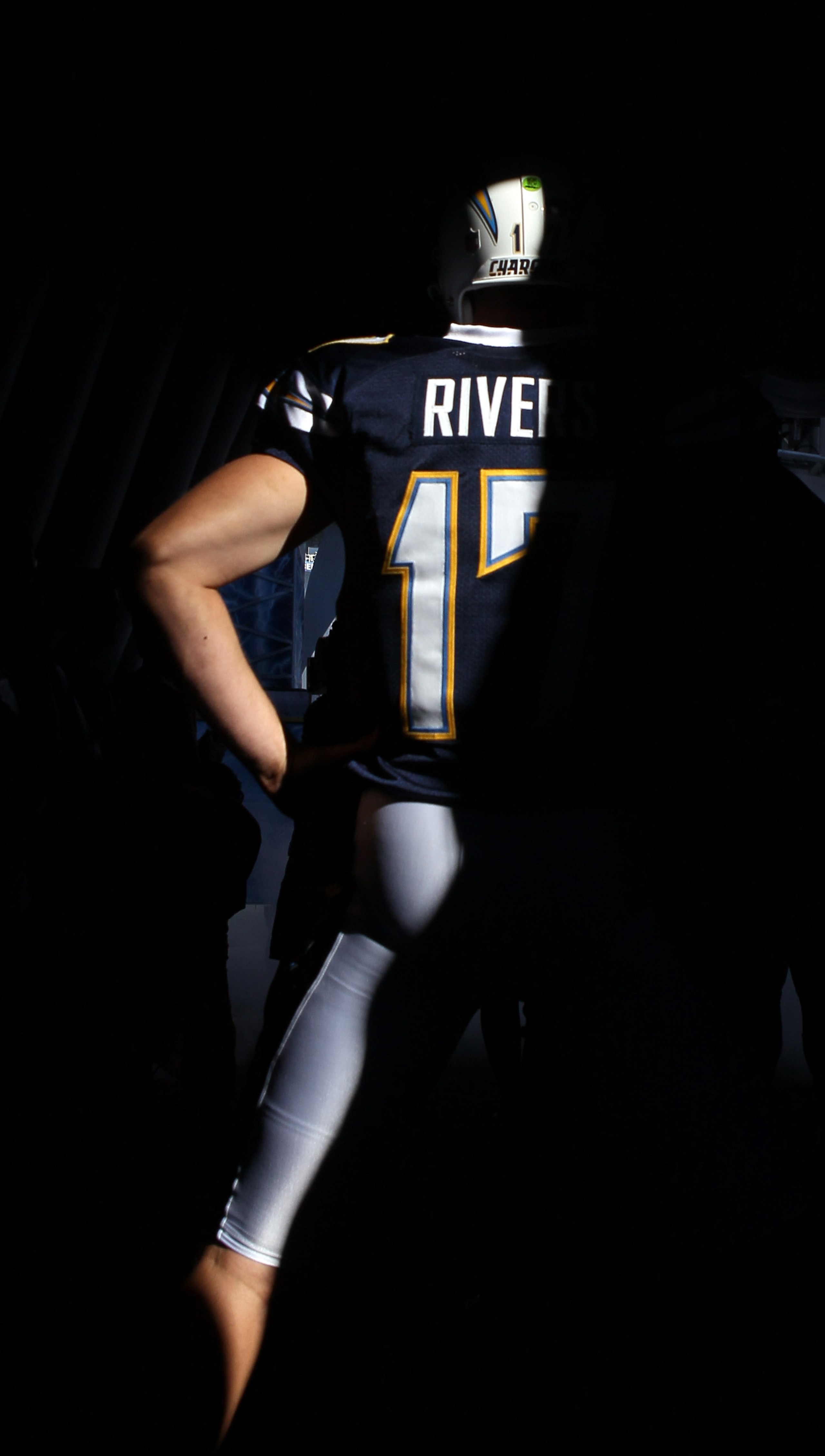SAN DIEGO - DECEMBER 12:  Quarterback Philip Rivers #17 of the San Diego Chargers walks into the inflatable tunnel for pregame introductions for the game against the Kansas City Chiefs at Qualcomm Stadium on December 12, 2010 in San Diego, California.  Th