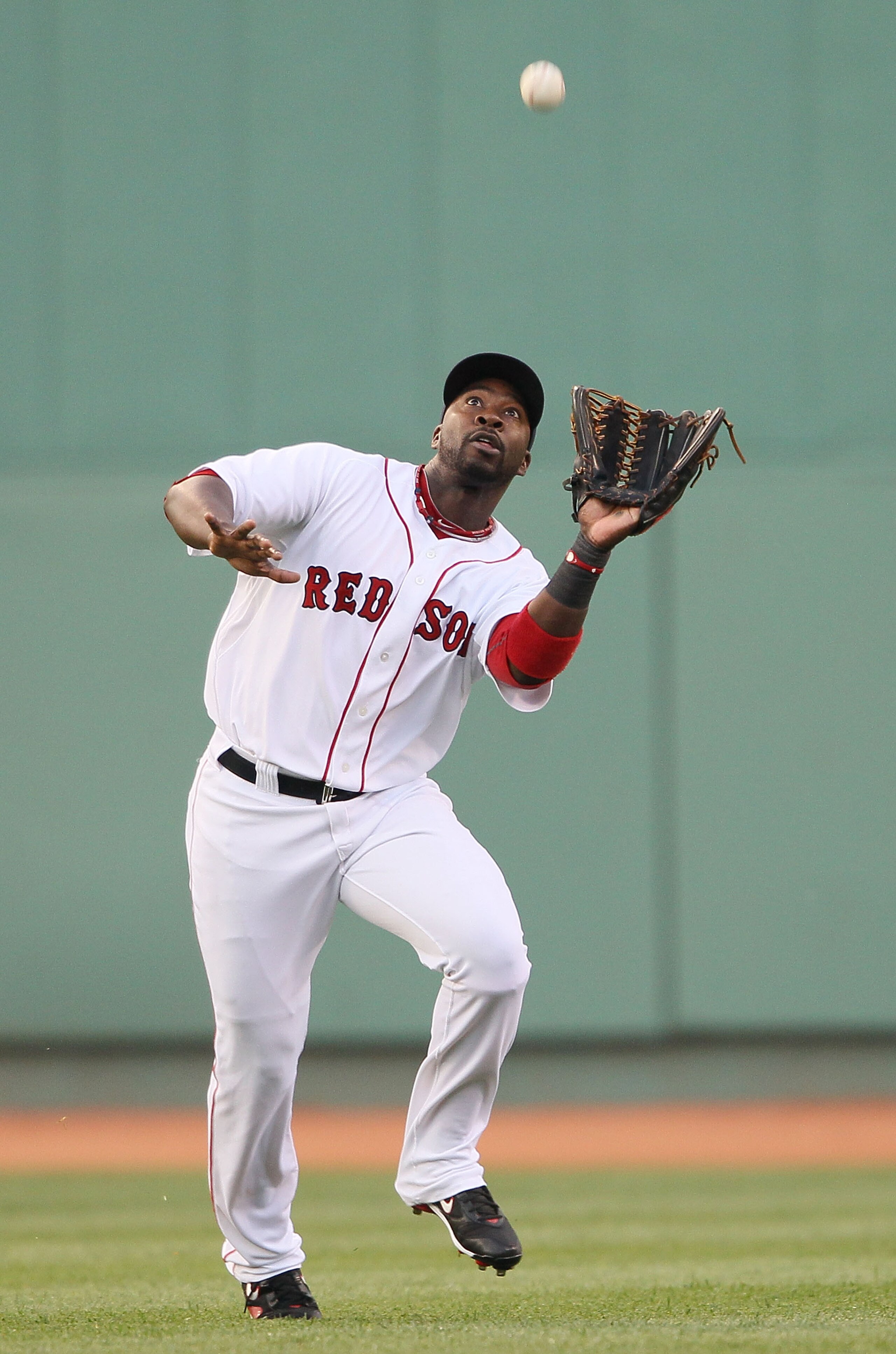 BOSTON - MAY 27:  Bill Hall #22 of the Boston Red Sox makes the catch for the out in the first inning against the Kansas City Royals on May 27, 2010 at Fenway Park in Boston, Massachusetts.  (Photo by Elsa/Getty Images)