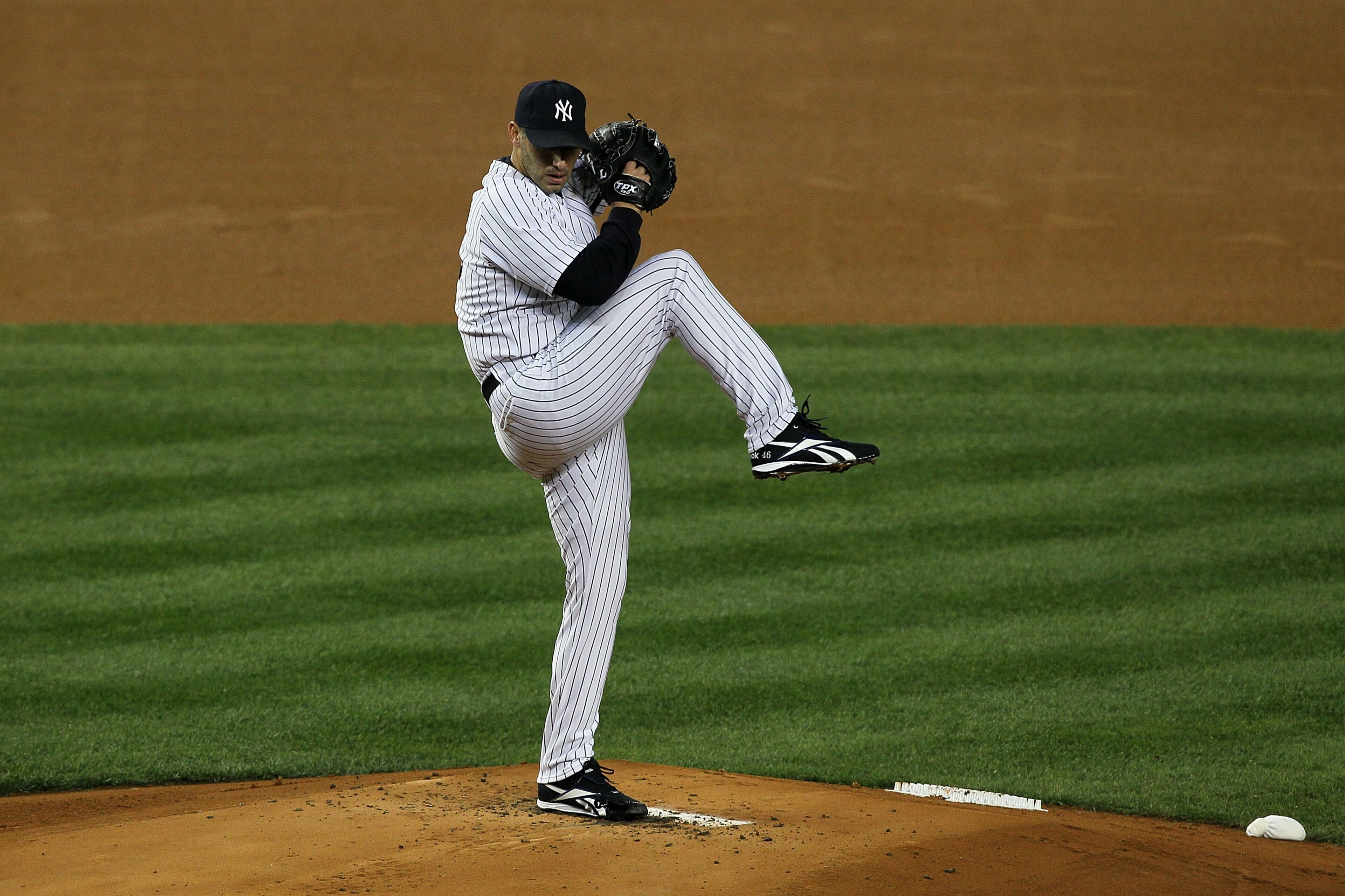 NEW YORK - OCTOBER 18: Starting pitcher Andy Pettitte #46 of the New York Yankees pitches against the Texas Rangers in Game Three of the ALCS during the 2010 MLB Playoffs at Yankee Stadium on October 18, 2010 in New York, New York. The Raners won 8-0. ( NEW YORK - OCTOBER 18: Starting pitcher Andy Pettitte #46 of the New York Yankees pitches against the Texas Rangers in Game Three of the ALCS during the 2010 MLB Playoffs at Yankee Stadium on October 18, 2010 in New York, New York. The Raners won 8-0. (