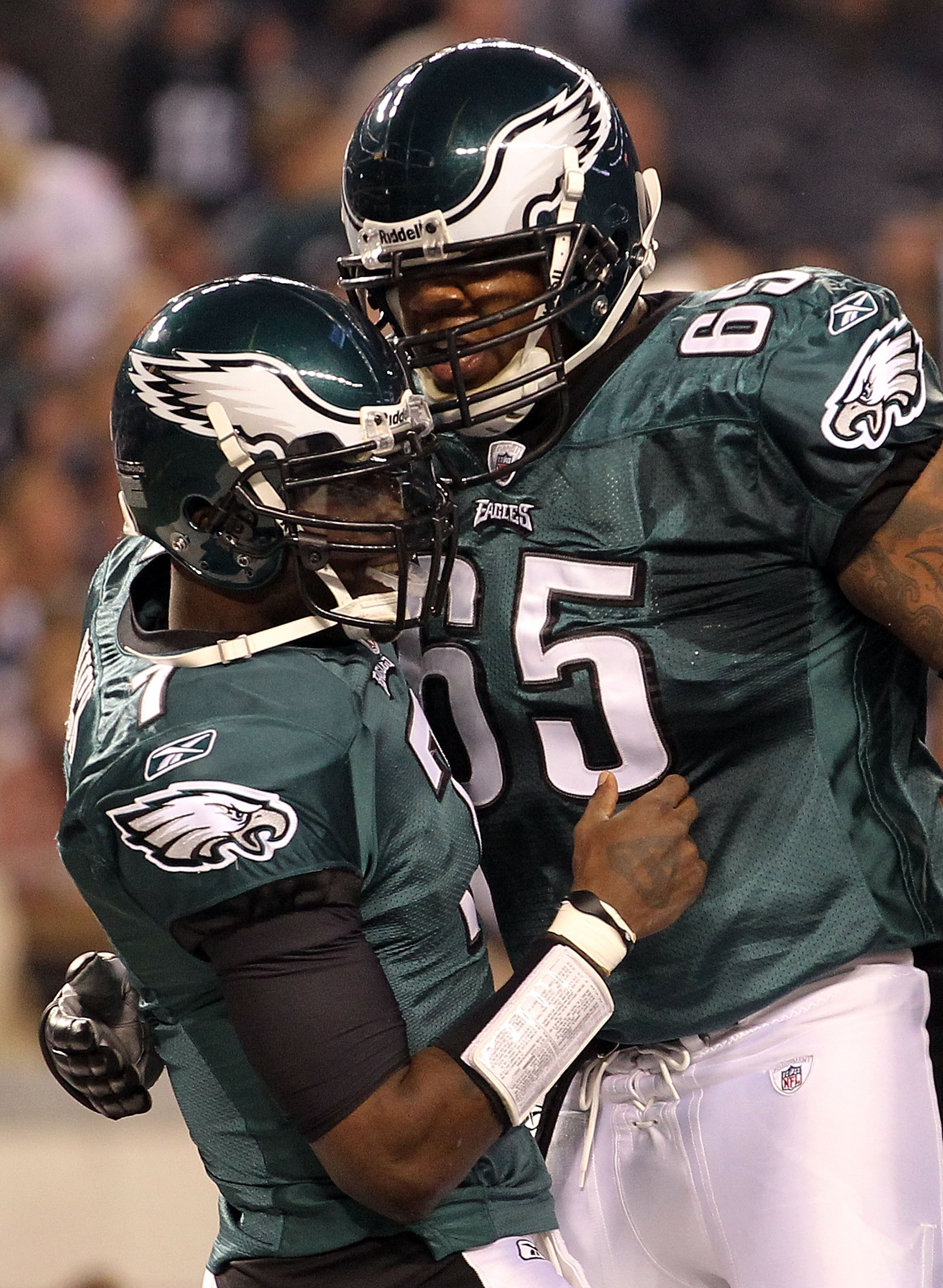 ARLINGTON, TX - DECEMBER 12:  Quarterback Michael Vick #7 of the Philadelphia Eagles celebrates his touchdown run with King Dunlap #65 against the Dallas Cowboys at Cowboys Stadium on December 12, 2010 in Arlington, Texas.  (Photo by Ronald Martinez/Getty