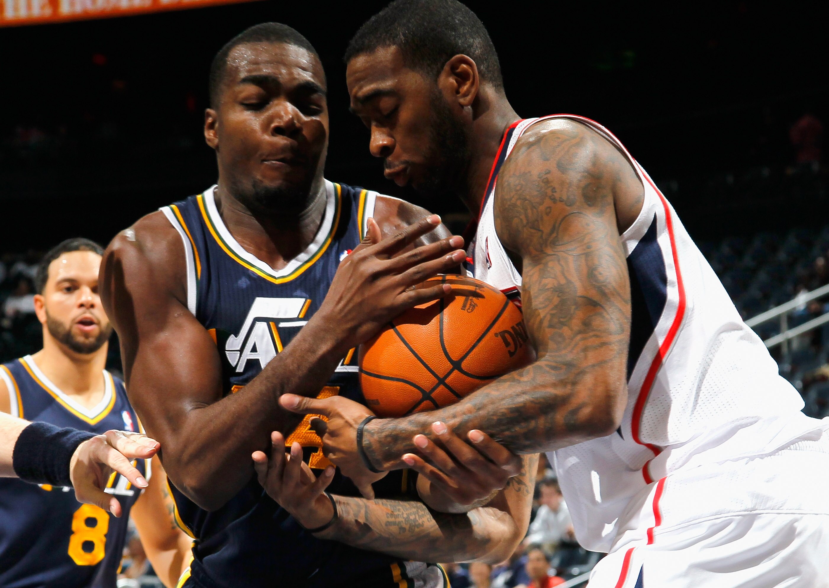 ATLANTA - NOVEMBER 12:  Josh Powell #12 of the Atlanta Hawks battles for a rebound against Paul Millsap #24 of the Utah Jazz at Philips Arena on November 12, 2010 in Atlanta, Georgia.  NOTE TO USER: User expressly acknowledges and agrees that, by download