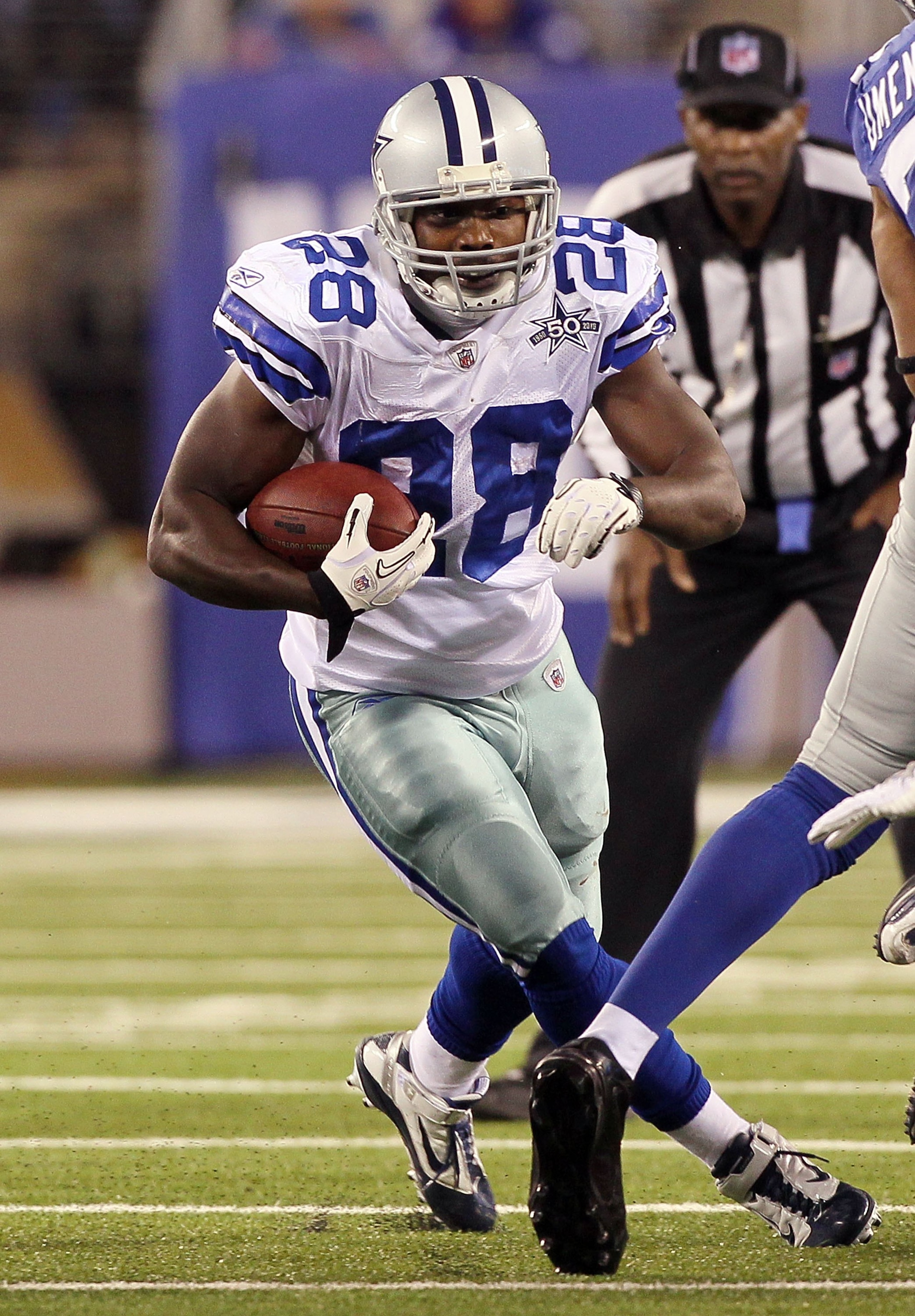 EAST RUTHERFORD, NJ - NOVEMBER 14:  Felix Jones #28 of the Dallas Cowboys runs against the New York Giants on November 14, 2010 at the New Meadowlands Stadium in East Rutherford, New Jersey. The Cowboys defeated the Giants 33-20.  (Photo by Jim McIsaac/Ge