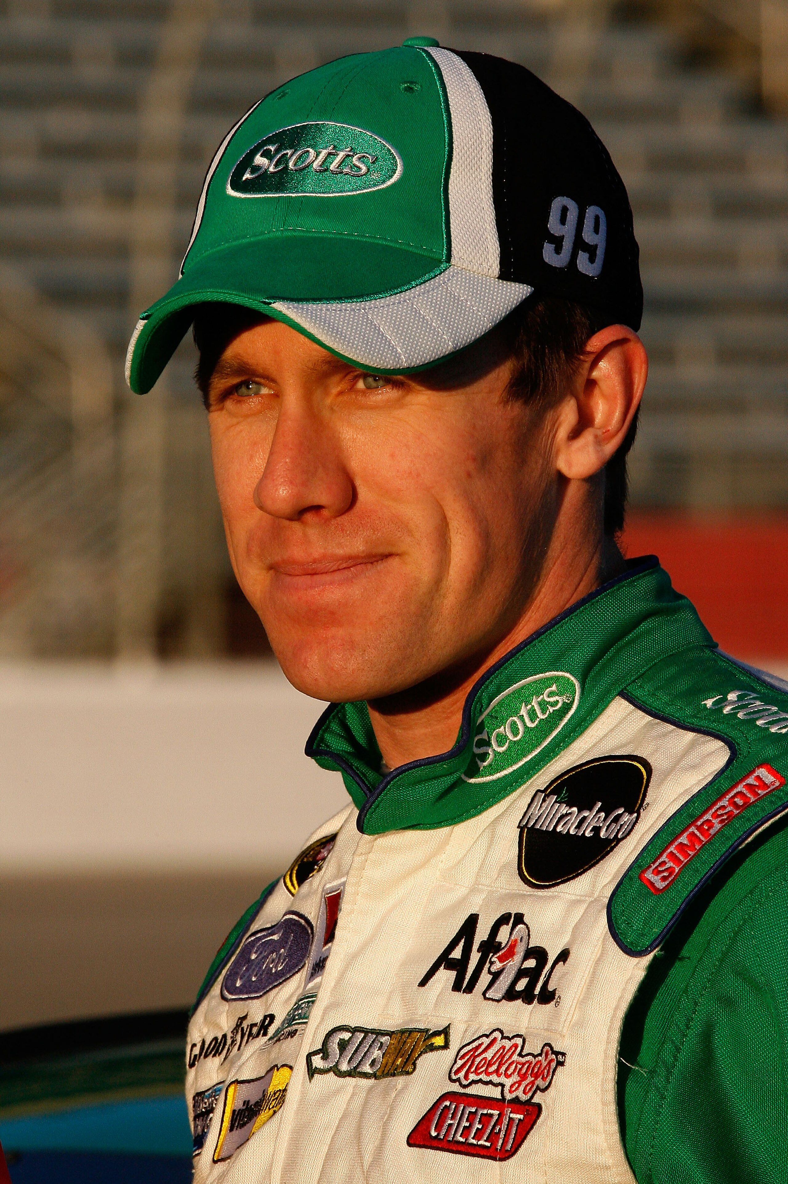 ATLANTA - MARCH 05:  Carl Edwards, driver of the #99 Scotts Ford, looks on after qualifying for the NASCAR Sprint Cup Series Kobalt Tools 500 at Atlanta Motor Speedway on March 5, 2010 in Hampton, Georgia.  (Photo by Tom Whitmore/Getty Images)