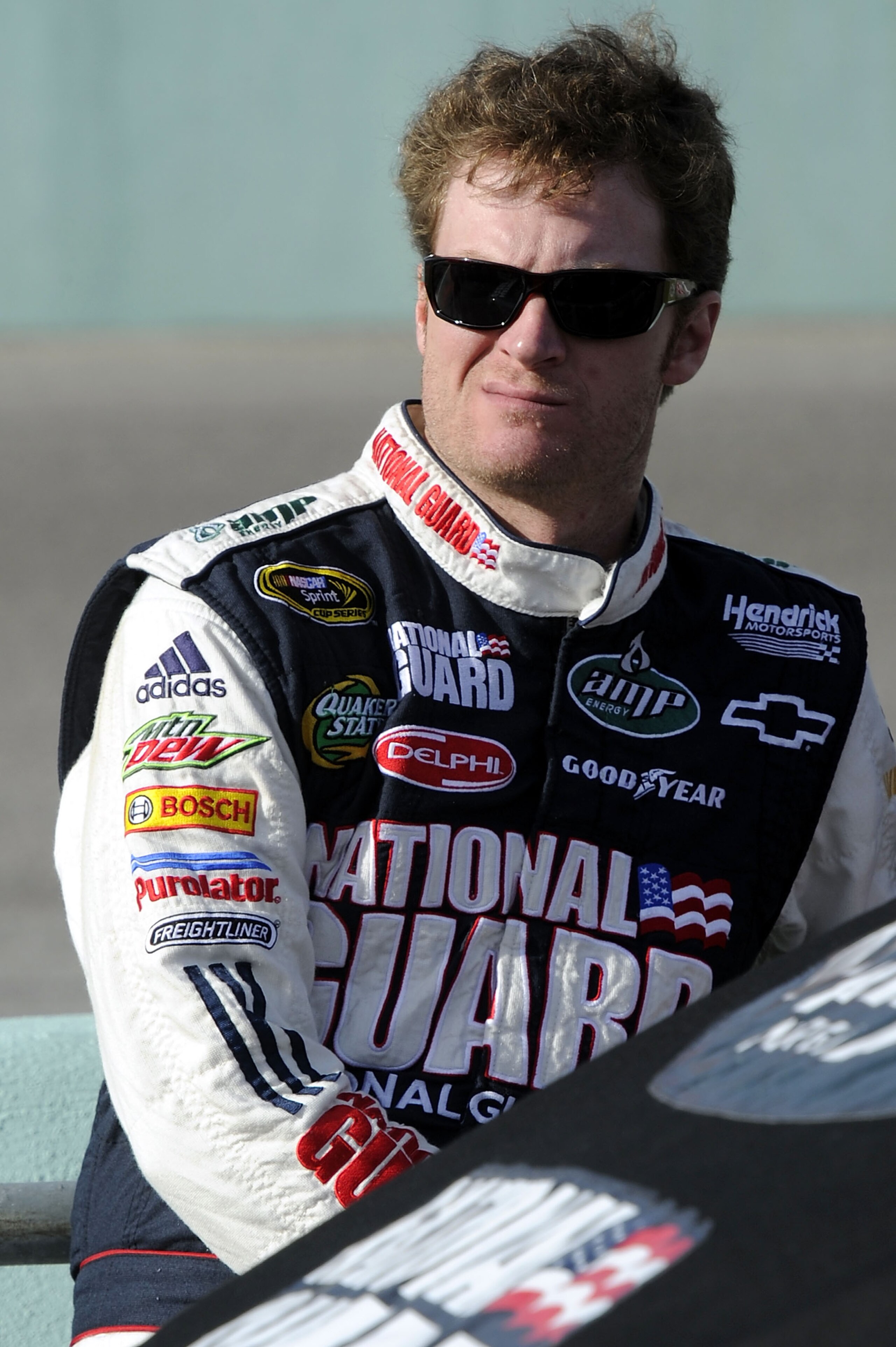 HOMESTEAD, FL - NOVEMBER 19:  Dale Earnhardt Jr., driver of the #88 National Guard/AMP Energy Chevrolet, stands on the grid during qualifying for the NASCAR Sprint Cup Series Ford 400 at Homestead-Miami Speedway on November 19, 2010 in Homestead, Florida.