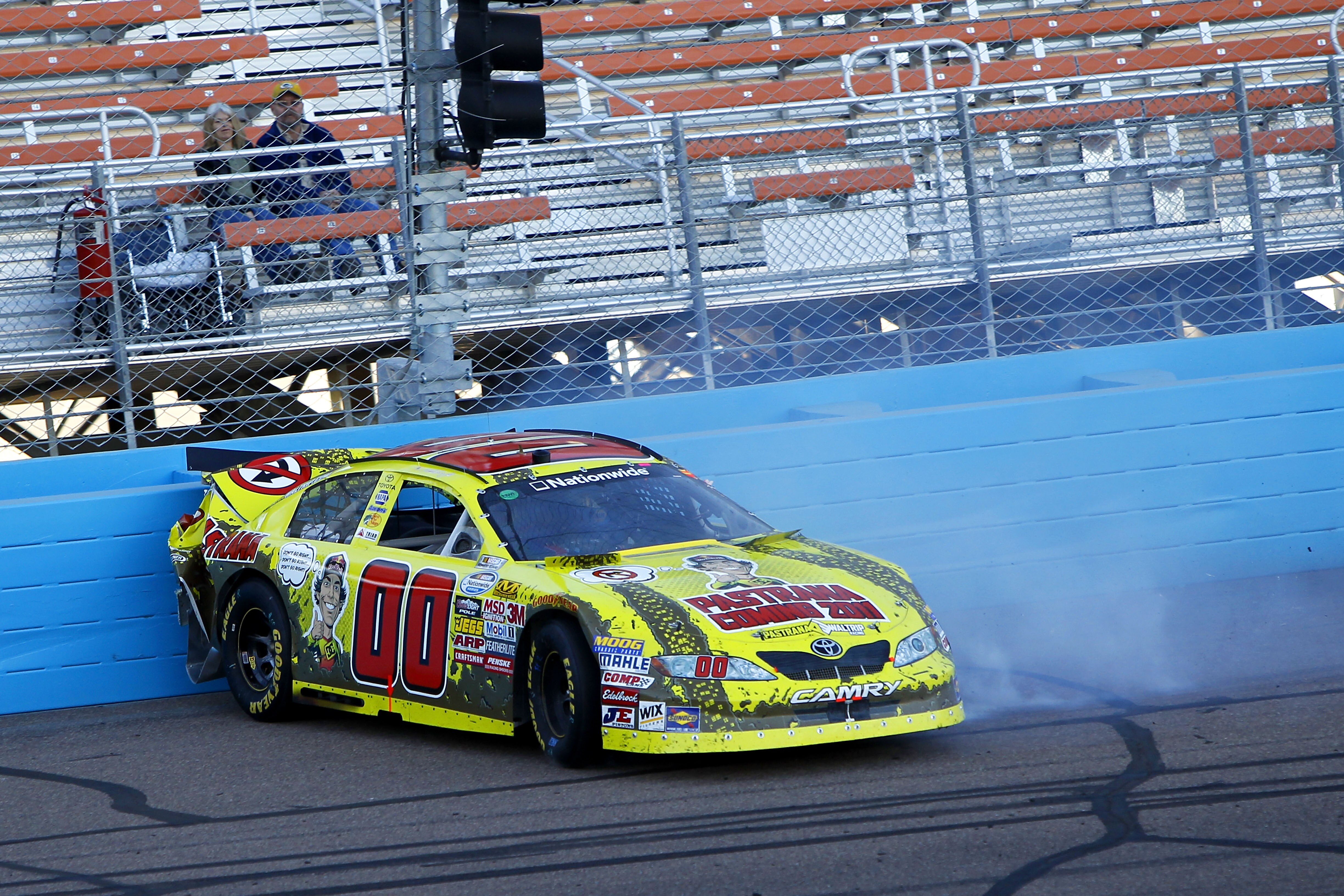 AVONDALE, AZ - NOVEMBER 13:  Martin Truex Jr., driver of the #00 Travis Pastrana Toyota, crashes during the NASCAR Nationwide Series WYPALL 200 at Phoenix International Raceway on November 13, 2010 in Avondale, Arizona.  (Photo by Chris Trotman/Getty Imag
