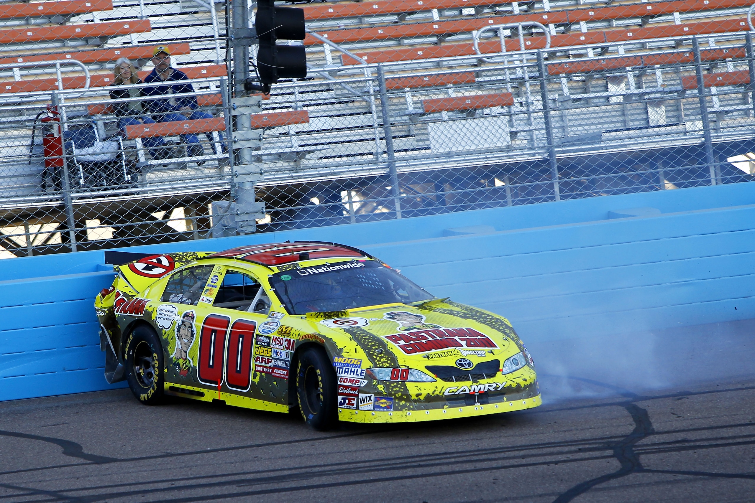 AVONDALE, AZ - NOVEMBER 13:  Martin Truex Jr., driver of the #00 Travis Pastrana Toyota, crashes during the NASCAR Nationwide Series WYPALL 200 at Phoenix International Raceway on November 13, 2010 in Avondale, Arizona.  (Photo by Chris Trotman/Getty Imag