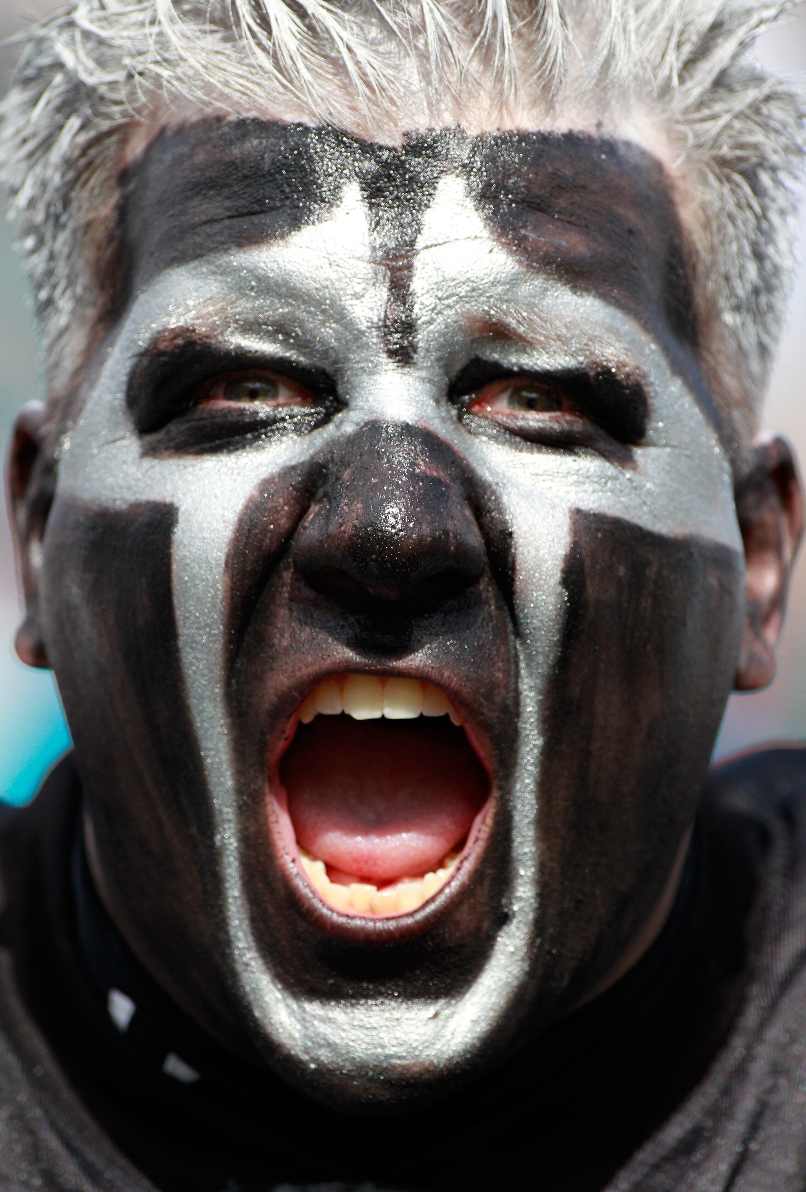 JACKSONVILLE, FL - DECEMBER 12:  A fan of the Oakland Raiders cheers during the game against the Jacksonville Jaguars at EverBank Field on December 12, 2010 in Jacksonville, Florida.  (Photo by Sam Greenwood/Getty Images)