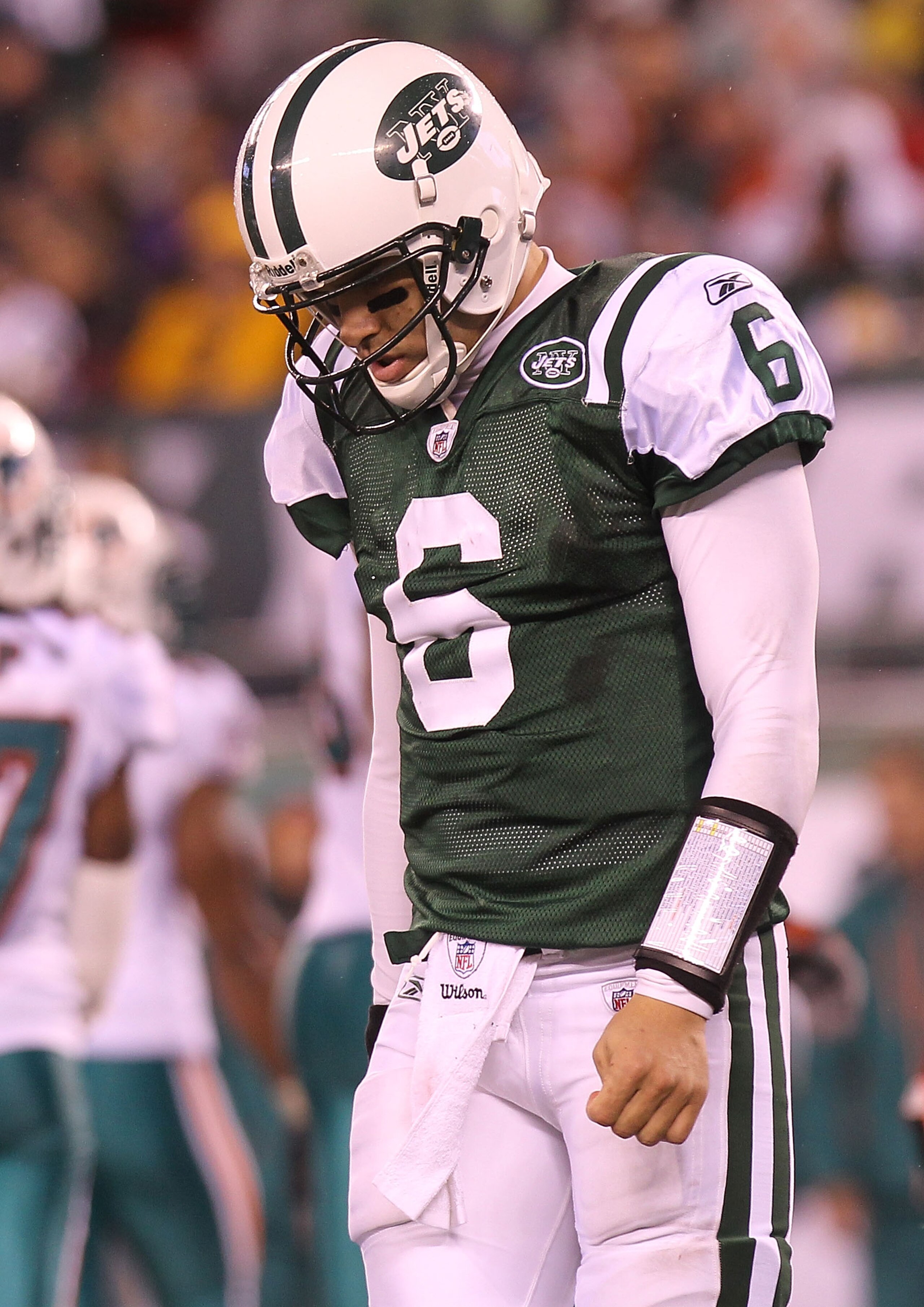 EAST RUTHERFORD, NJ - DECEMBER 12:  Mark Sanchez #6 of the New York Jets walks from the field after failing to convert a fourth down against the Miami Dolphins at New Meadowlands Stadium on December 12, 2010 in East Rutherford, New Jersey.  (Photo by Nick