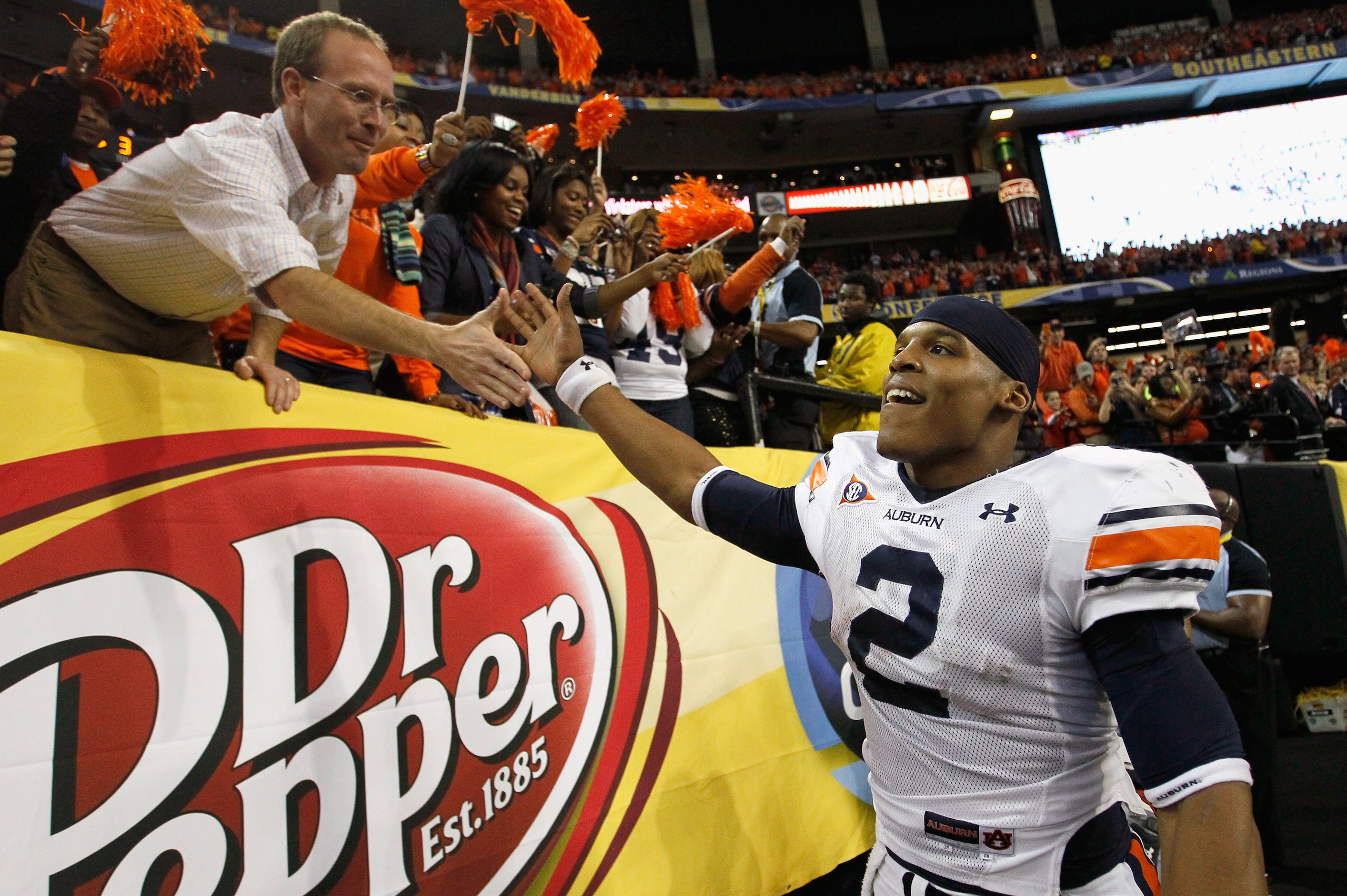 ATLANTA, GA - DECEMBER 04: Quarterback Cam Newton #2 of the Auburn Tigers celebrates after their 56-17 win over the South Carolina Gamecocks during the 2010 SEC Championship at Georgia Dome on December 4, 2010 in Atlanta, Georgia. (Photo by Kevin C. Cox ATLANTA, GA - DECEMBER 04: Quarterback Cam Newton #2 of the Auburn Tigers celebrates after their 56-17 win over the South Carolina Gamecocks during the 2010 SEC Championship at Georgia Dome on December 4, 2010 in Atlanta, Georgia. (Photo by Kevin C. Cox