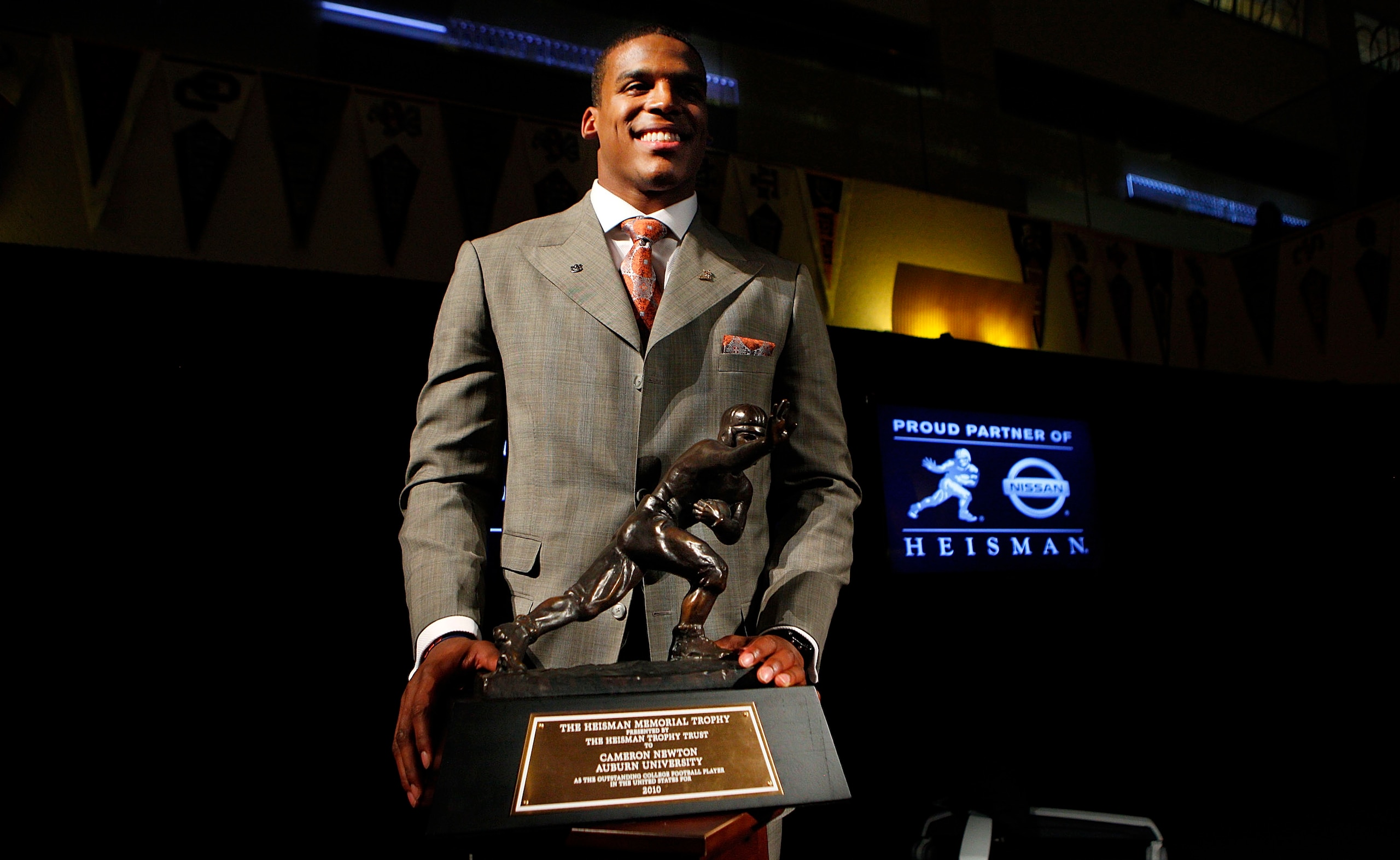 NEW YORK - DECEMBER 11:  Cam Newton, quarterback of the Auburn University Tigers, poses with the 2010 Heisman Memorial Trophy Award on December 11, 2010 in New York City.  (Photo by Jeff Zelevansky/Getty Images)