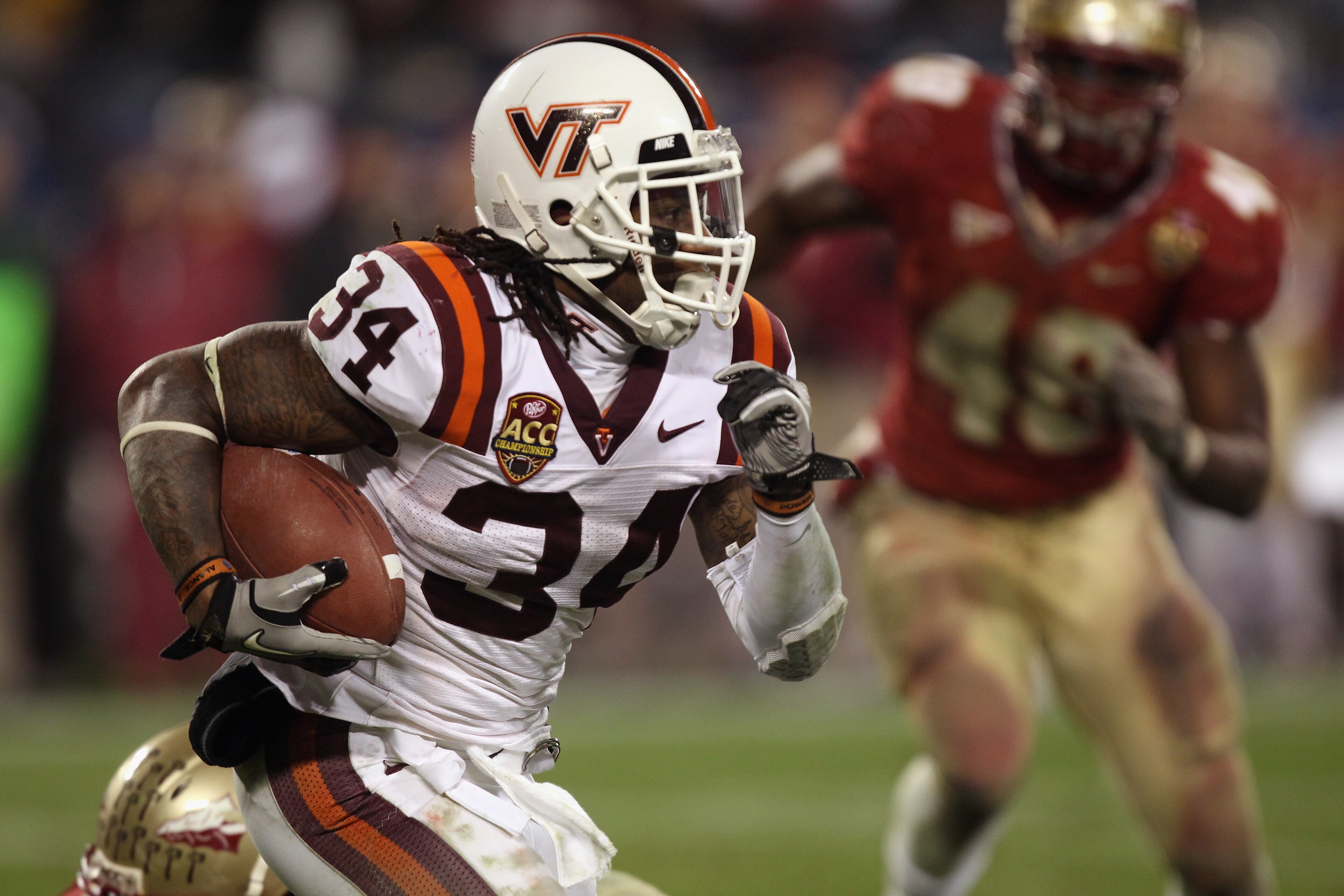 CHARLOTTE, NC - DECEMBER 04:  Ryan Williams #34 of the Virginia Tech Hokies runs with the ball against the Florida State Seminoles during their game at Bank of America Stadium on December 4, 2010 in Charlotte, North Carolina.  (Photo by Streeter Lecka/Get