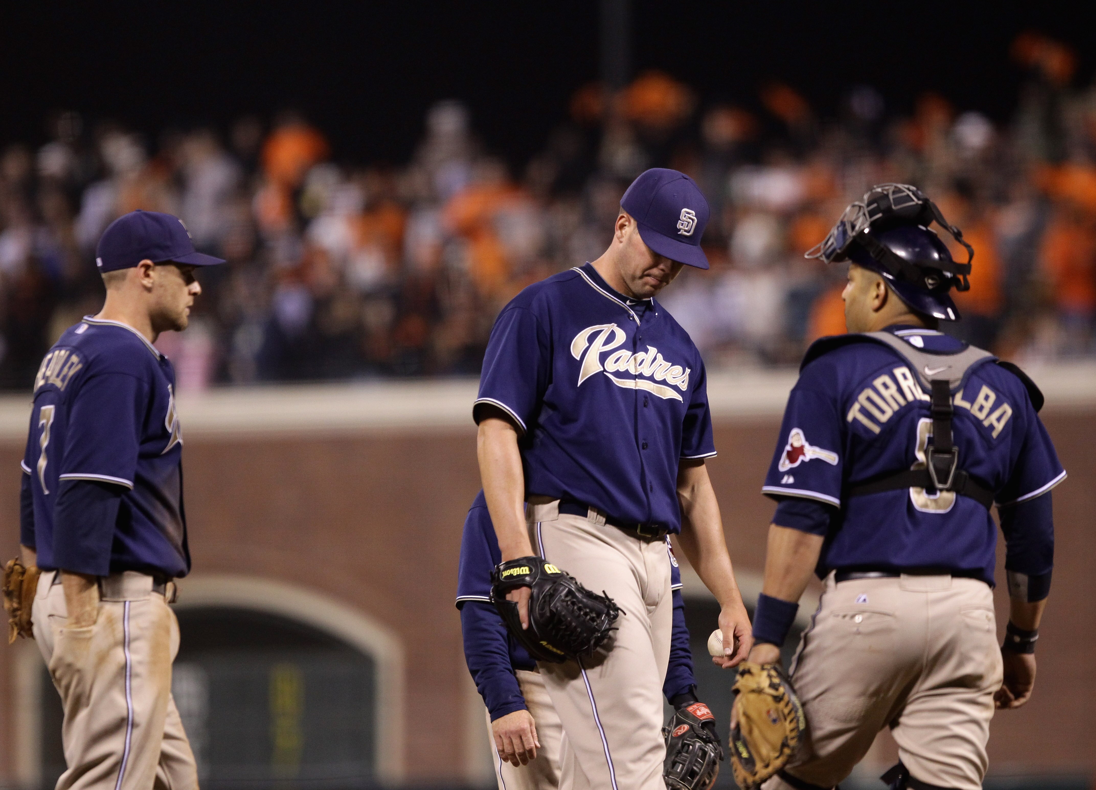 SAN FRANCISCO - OCTOBER 01:  Clayton Richard #33 of the San Diego Padres is surrounded by teammates as he waits for manager Bud Black to take him out of the game after he gave up a home run to Aaron Rowand #33 of the San Francisco Giants in the sixth inni