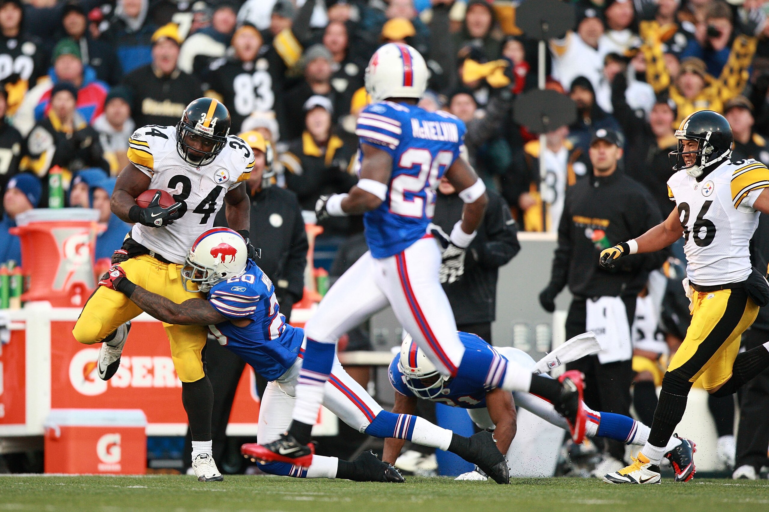ORCHARD PARK, NY - NOVEMBER 28:  Rashard Mendenhall #34 of the Pittsburgh Steelers is tackled by Donte Whitner #20 of the Buffalo Bills during their game at Ralph Wilson Stadium on November 28, 2010 in Orchard Park, New York.  (Photo by Karl Walter/Getty