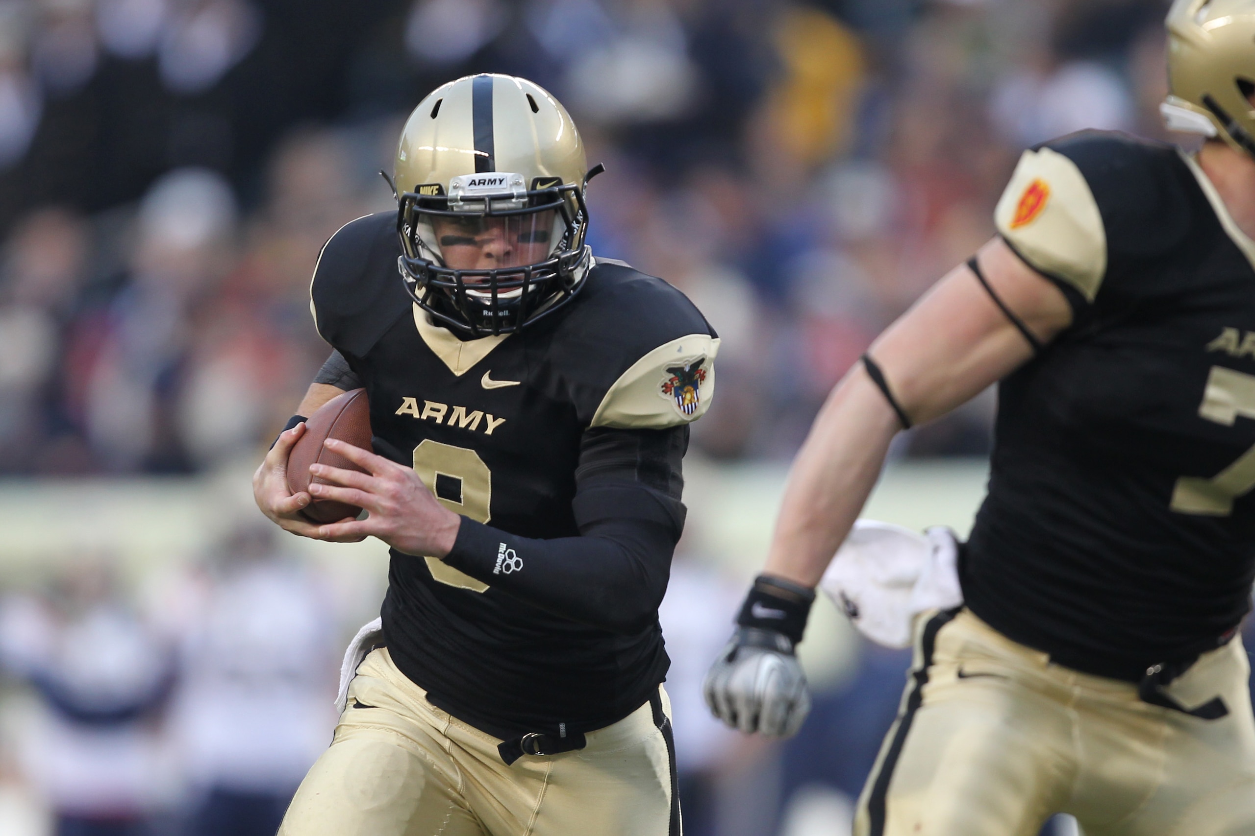 PHILADELPHIA - DECEMBER 11: Quarterback Trent Steelman #8 of the Army Black Knights runs with the ball during the game against the Navy Midshipmen on December 11, 2010 at Lincoln Financial Field in Philadelphia, Pennsylvania. The Midshipmen won 31-17. (Ph