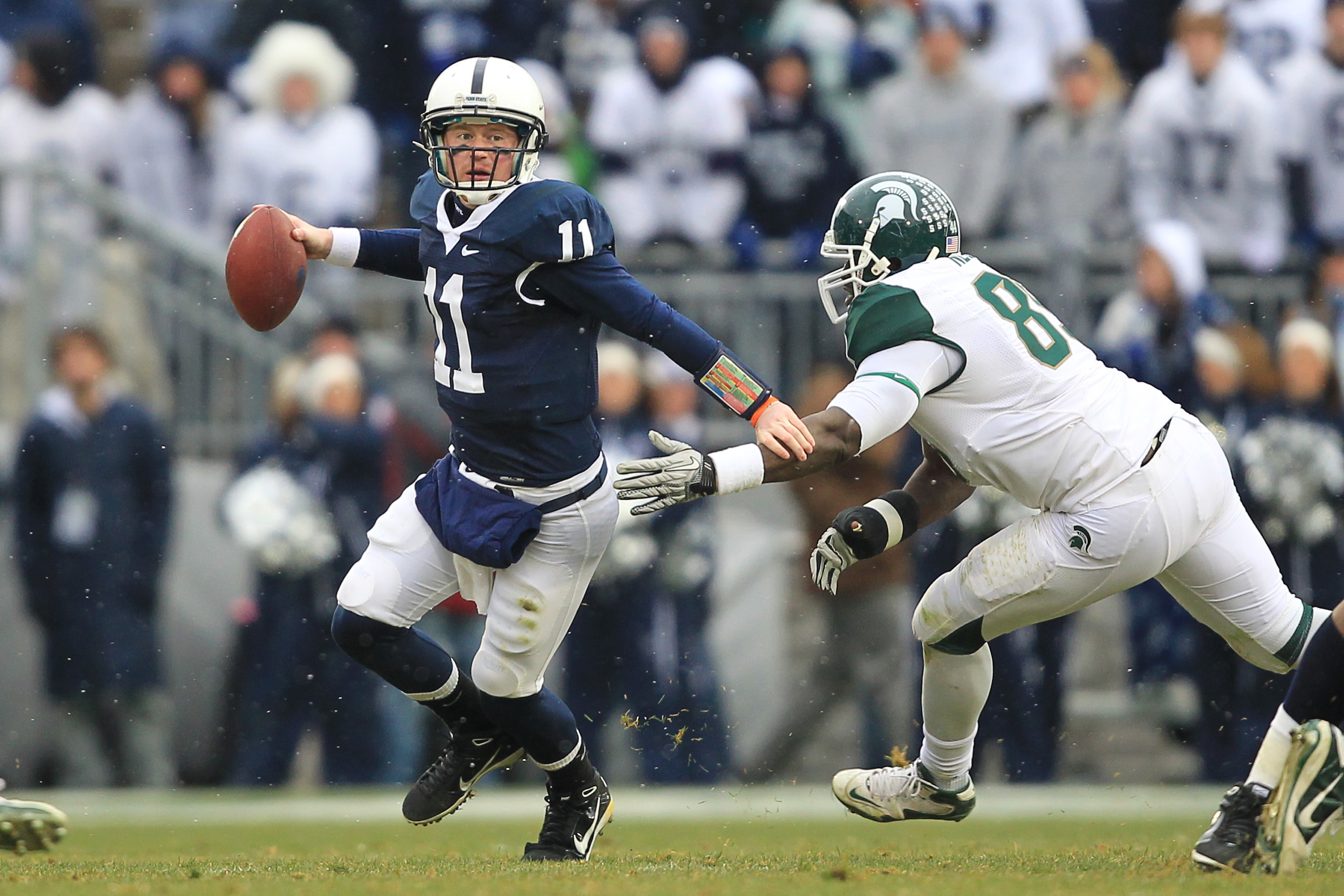 STATE COLLEGE, PA - NOVEMBER 27: Quarterback Matt McGloin #11 of the Penn State Nittany Lions scrambles out of the pocket during a game against the Michigan State Spartans on November 27, 2010 at Beaver Stadium in State College, Pennsylvania. The Spartans