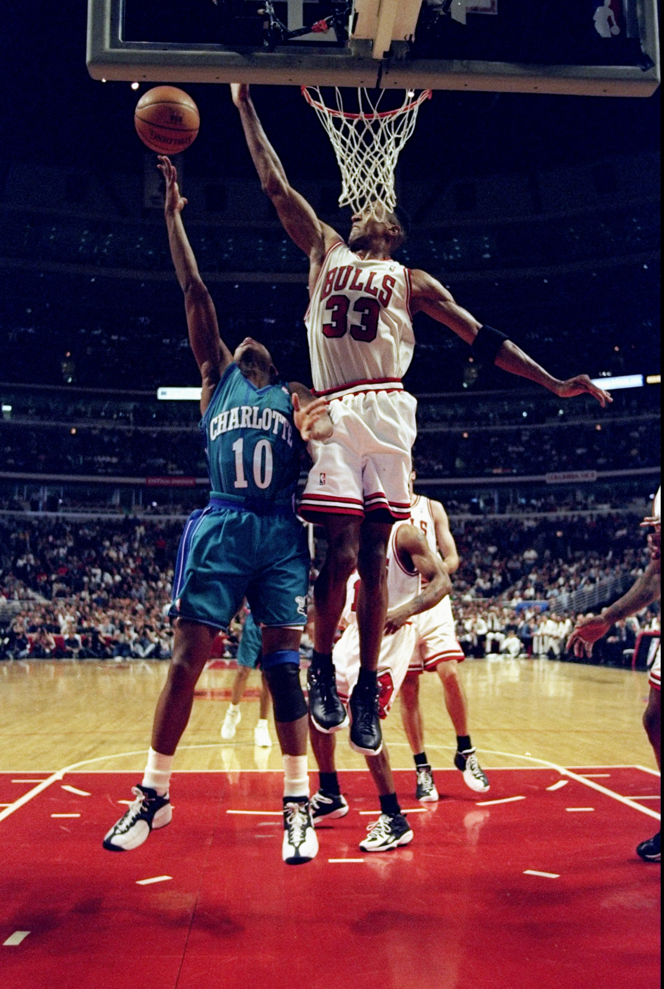 13 May 1998: B.J Armstrong #10 of the Charlotte Hornets makes a lay-up as Scottie Pippen #33 of the Chicago Bulls tries to block at the United Center in Chicago, Illinios. The Bulls defeated the Hornets 93-84. Mandatory Credit: Jonathan Daniel  /Allsport