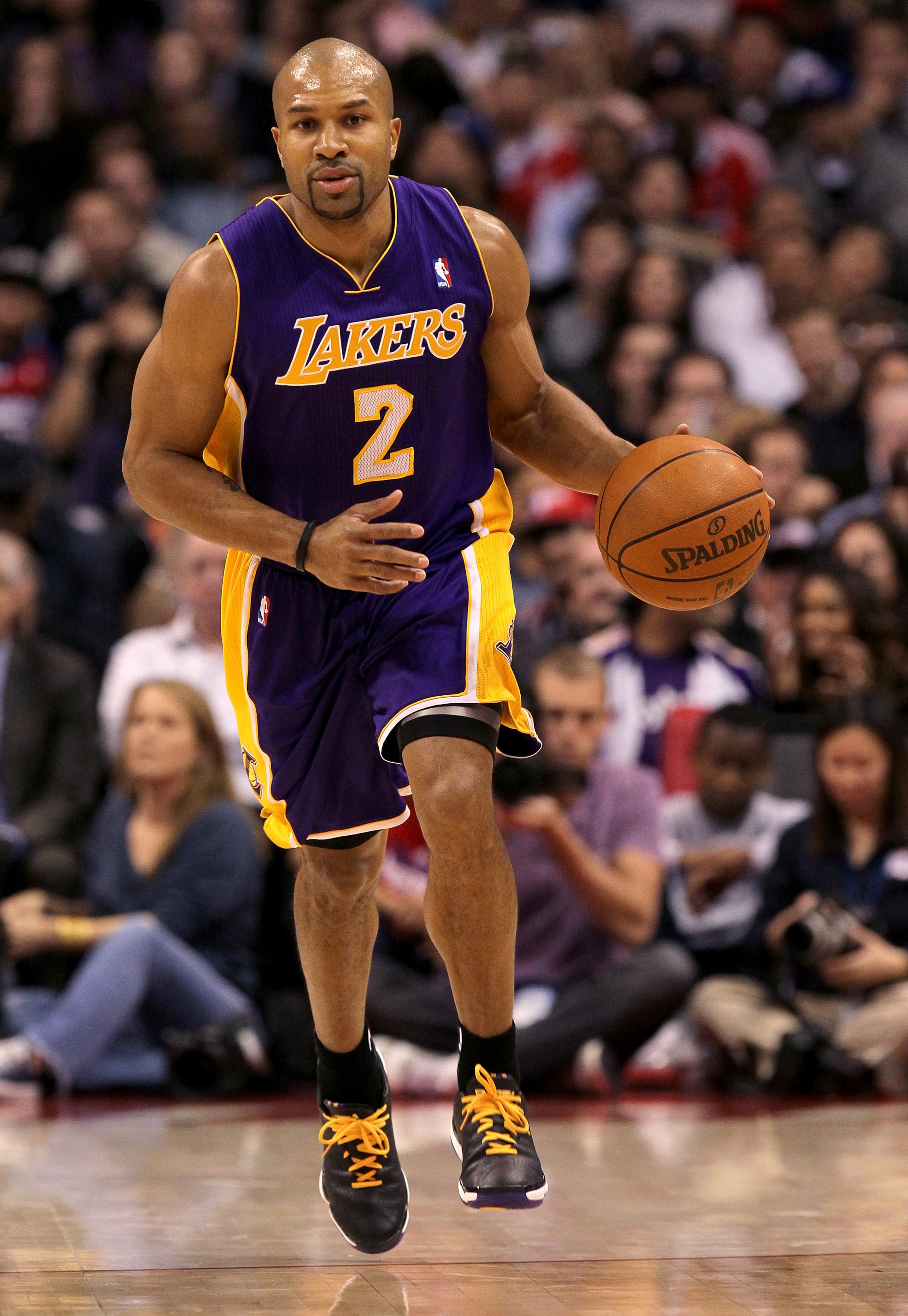 LOS ANGELES, CA - DECEMBER 8:  Derek Fisher #2 of the Los Angeles Lakers brings the ball upcourt against the Los Angeles Clippers at Staples Center on December 8, 2010 in Los Angeles, California.  NOTE TO USER: User expressly acknowledges and agrees that,