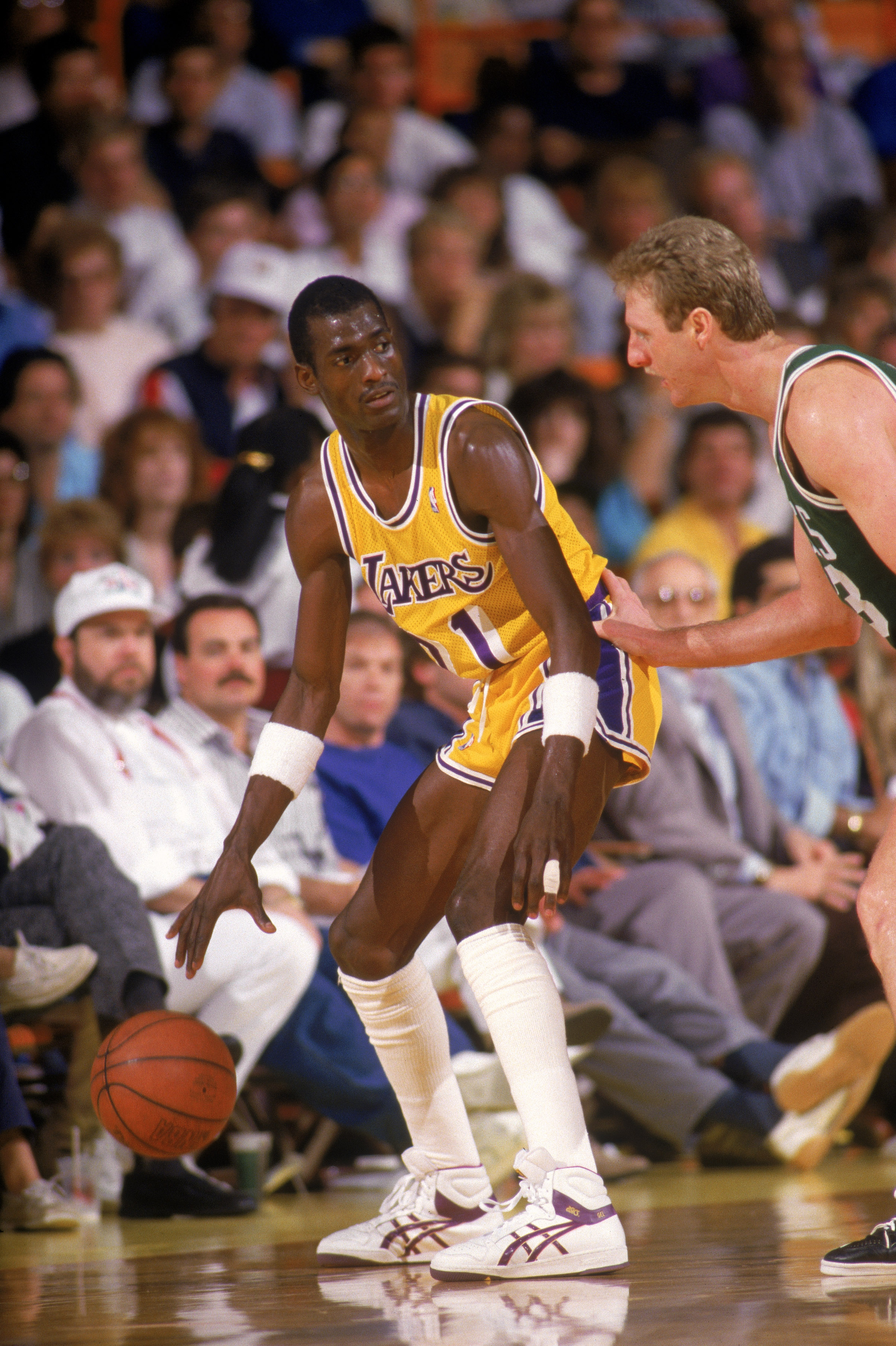 LOS ANGELES - 1987: Michael Cooper #21 of the Los Angeles Lakers looks to pass over Larry Bird #33 of the Boston Celtics during an NBA game at the Great Western Forum in Los Angeles, California in 1987. (Photo by: Rick Stewart/Getty Images) LOS ANGELES - 1987: Michael Cooper #21 of the Los Angeles Lakers looks to pass over Larry Bird #33 of the Boston Celtics during an NBA game at the Great Western Forum in Los Angeles, California in 1987. (Photo by: Rick Stewart/Getty Images)