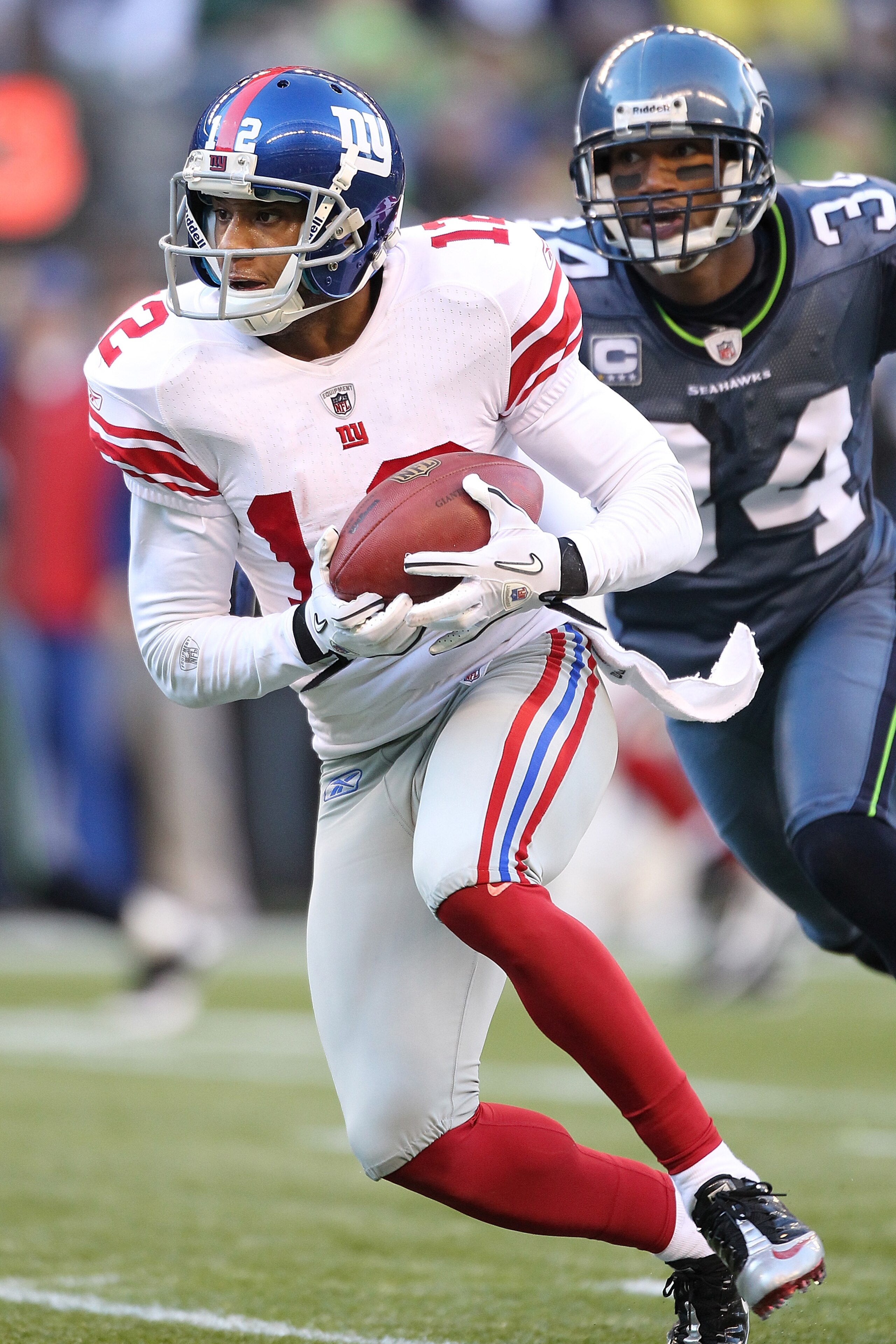SEATTLE - NOVEMBER 07: Wide receiver Steve Smith #12 of the New York Giants rushes against Roy Lewis #34 of the Seattle Seahawks at Qwest Field on November 7, 2010 in Seattle, Washington. The Giants defeated the Seahawks 41-7. (Photo by Otto Greule Jr/Ge SEATTLE - NOVEMBER 07: Wide receiver Steve Smith #12 of the New York Giants rushes against Roy Lewis #34 of the Seattle Seahawks at Qwest Field on November 7, 2010 in Seattle, Washington. The Giants defeated the Seahawks 41-7. (Photo by Otto Greule Jr/Ge