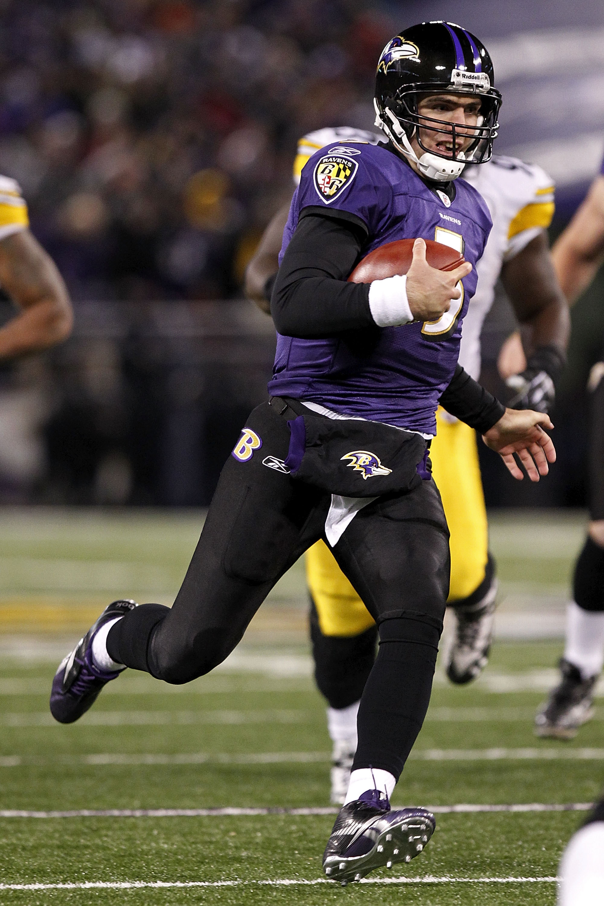 BALTIMORE, MD - DECEMBER 05:  Joe Flacco #5 of the Baltimore Ravens runs with the ball against the Pittsburgh Steelers at M&T Bank Stadium on December 5, 2010 in Baltimore, Maryland.  (Photo by Geoff Burke/Getty Images)