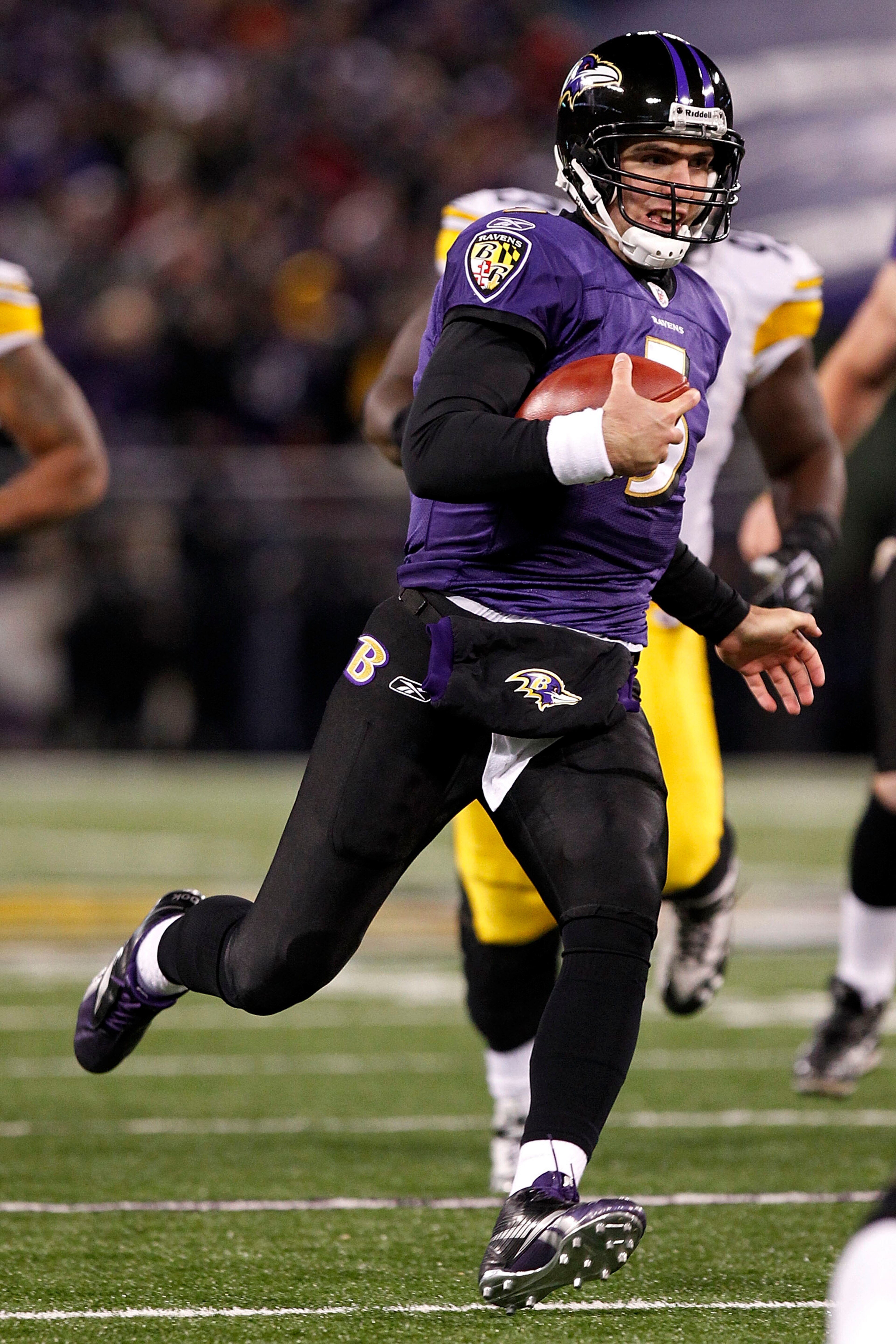 BALTIMORE, MD - DECEMBER 05:  Joe Flacco #5 of the Baltimore Ravens runs with the ball against the Pittsburgh Steelers at M&T Bank Stadium on December 5, 2010 in Baltimore, Maryland.  (Photo by Geoff Burke/Getty Images)