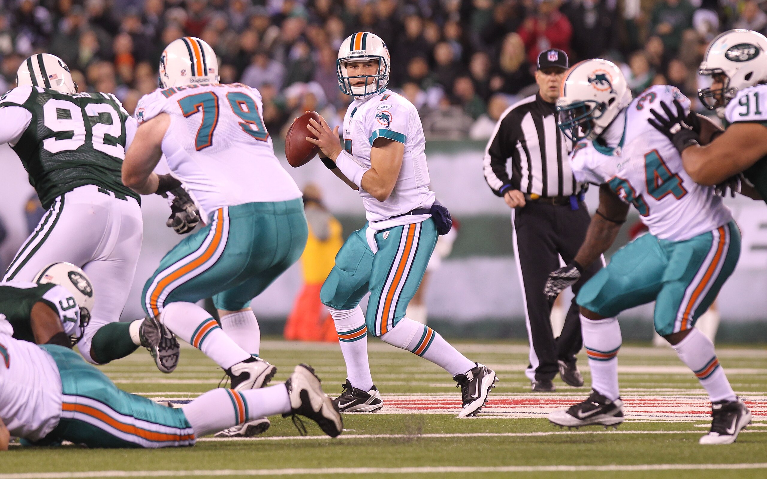 EAST RUTHERFORD, NJ - DECEMBER 12:  Chad Henne #7 of the Miami Dolphins passes against the New York Jets at New Meadowlands Stadium on December 12, 2010 in East Rutherford, New Jersey.  (Photo by Nick Laham/Getty Images)