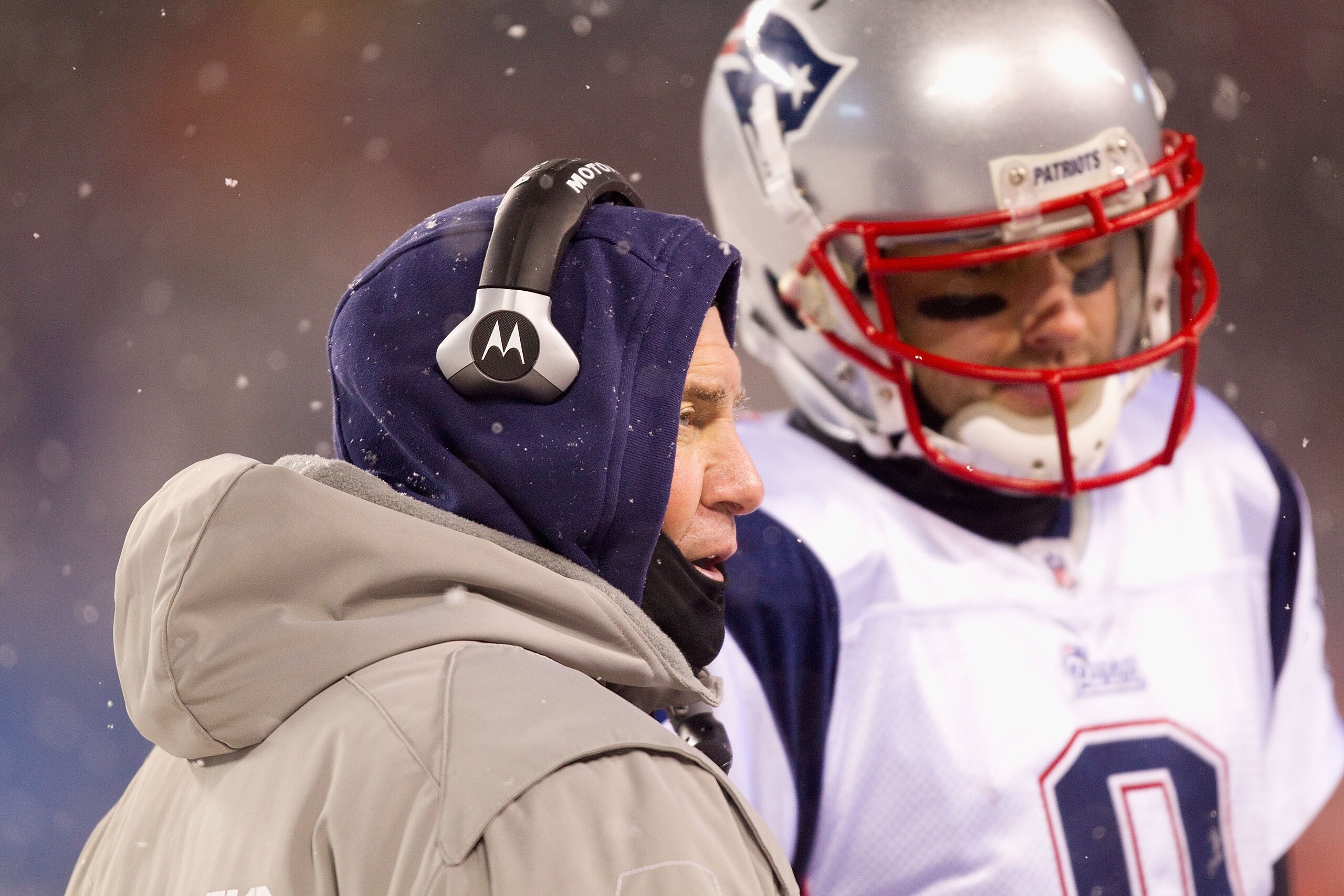 CHICAGO, IL - DECEMBER 12: Head coach Bill Belichick of the New England Patriots conducts a meeting during a time-out against the Chicago Bears at Soldier Field on December 12, 2010 in Chicago, Illinois.  The Patriots beat the Bears 36-7.  (Photo by Dilip