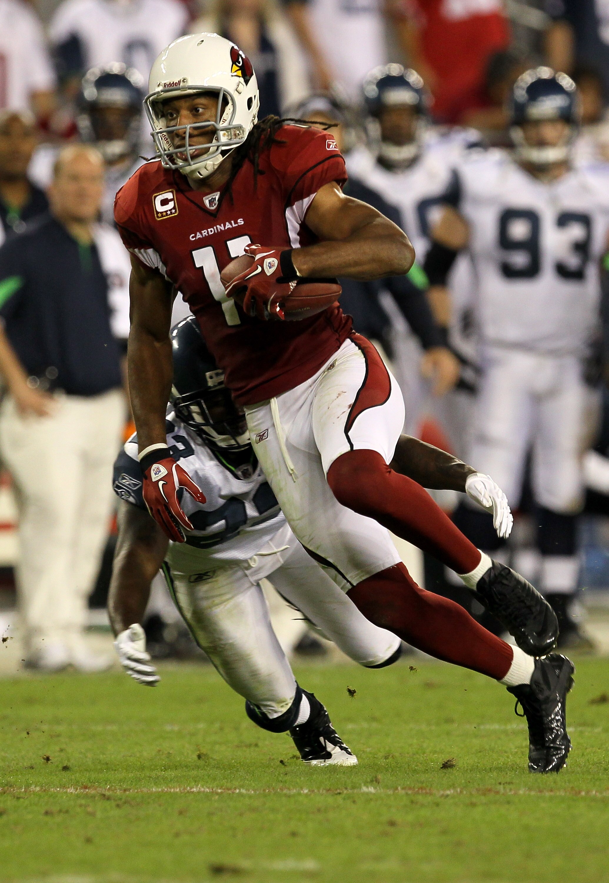 GLENDALE, AZ - NOVEMBER 14:  Wide receiver Larry Fitzgerald #11 of the Arizona Cardinals carries the ball against the Seattle Seahawks at University of Phoenix Stadium on November 14, 2010 in Glendale, Arizona. Seattle won 36-18.  (Photo by Stephen Dunn/G