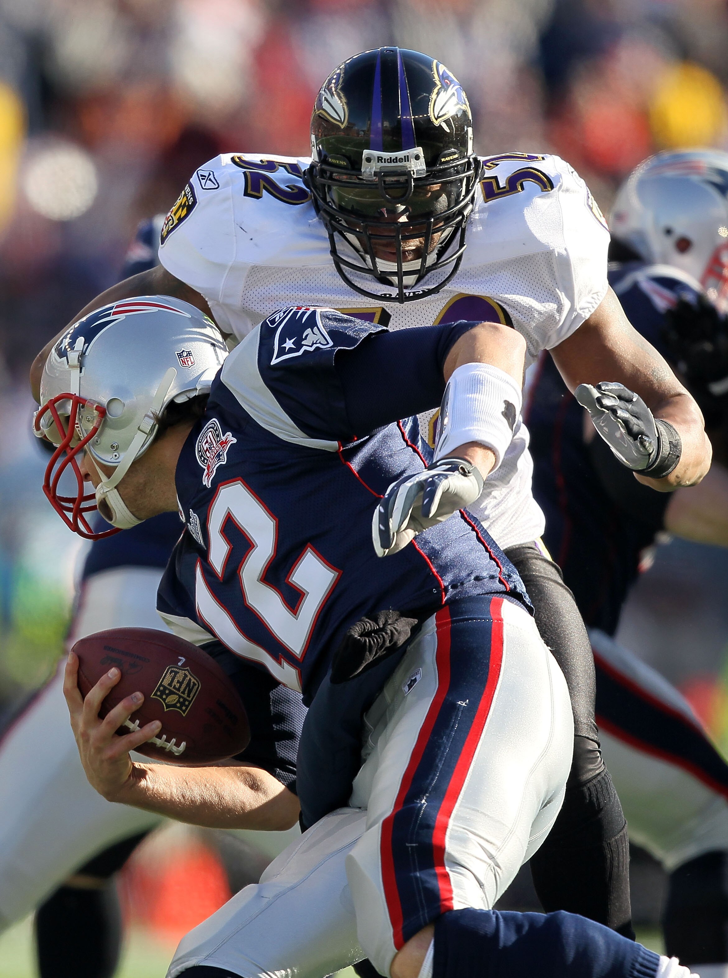 FOXBORO, MA - JANUARY 10:  Ray Lewis #52 of the Baltimore Ravens applies pressure as he sacks Tom Brady #12 of the New England Patriots during the 2010 AFC wild-card playoff game at Gillette Stadium on January 10, 2010 in Foxboro, Massachusetts.  (Photo b
