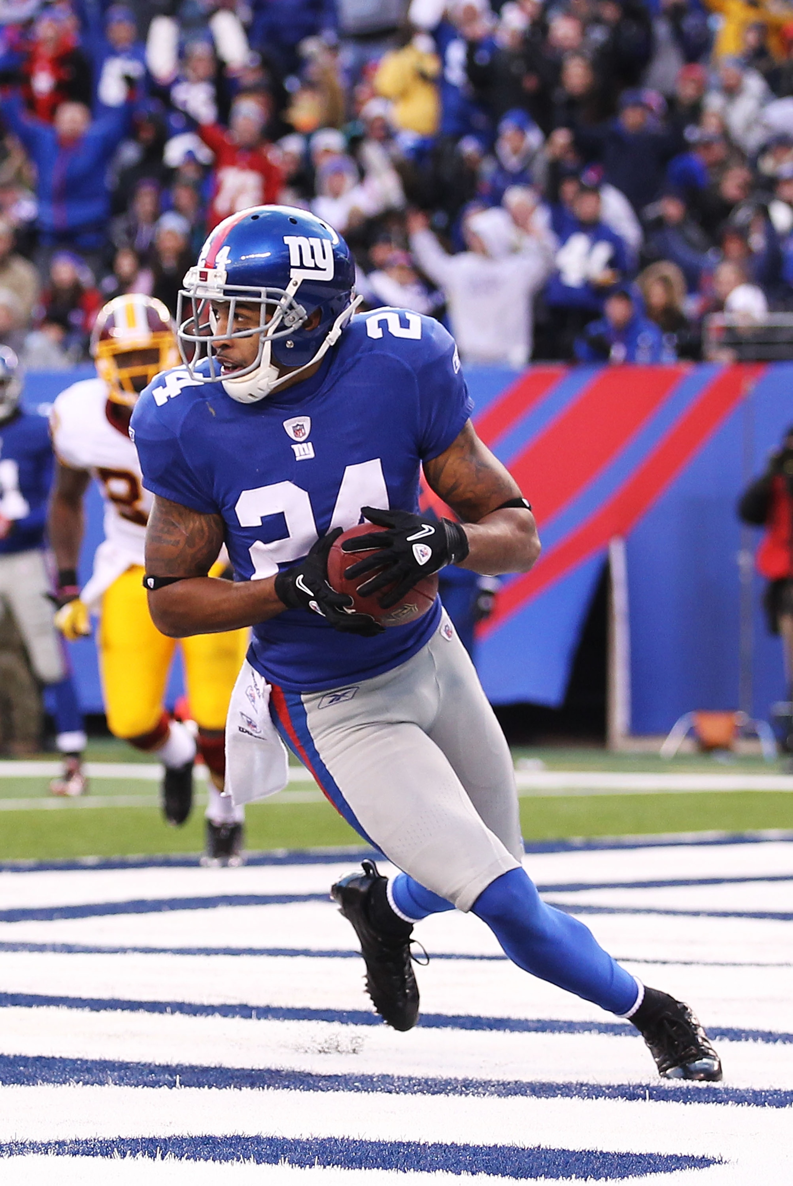 EAST RUTHERFORD, NJ - DECEMBER 05:  Terrell Thomas #24  of the New York Giants intercepts the ball against the Washington Redskins during their game on December 5, 2010 at The New Meadowlands Stadium in East Rutherford, New Jersey.  (Photo by Al Bello/Get
